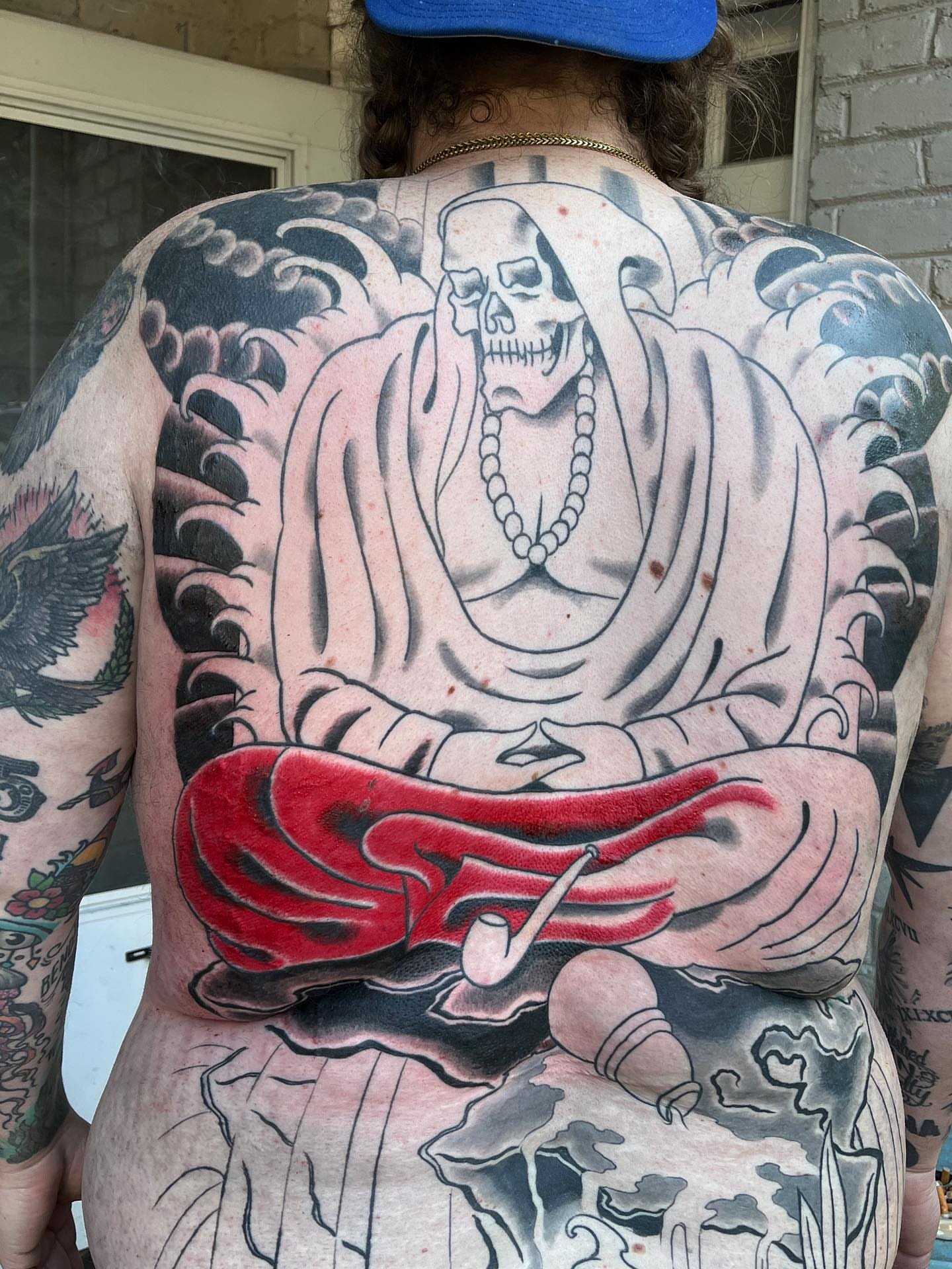 Meditating skeleton American traditional tattoo on the back by TYP 419, Toledo, Ohio