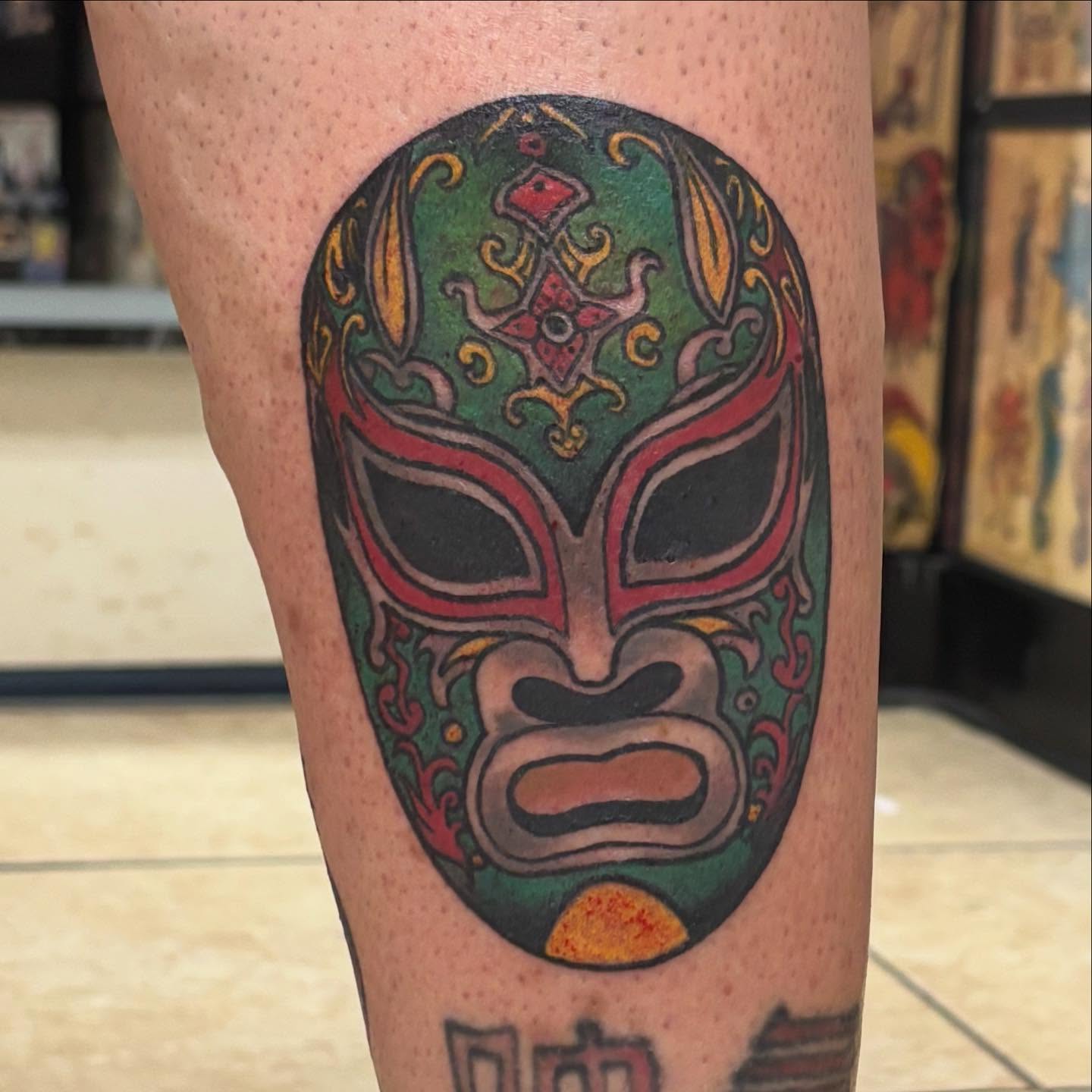 Lucha libre mask Chicano tattoo on the forearm by Oscar Cuéllar (Kue-Yar)