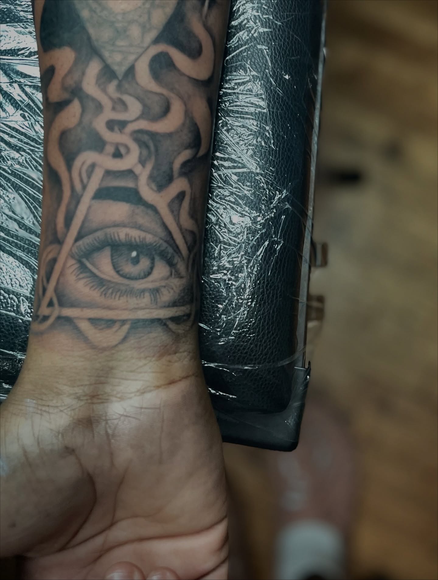 Eye with maze geometric tattoo on the forearm by Koolz