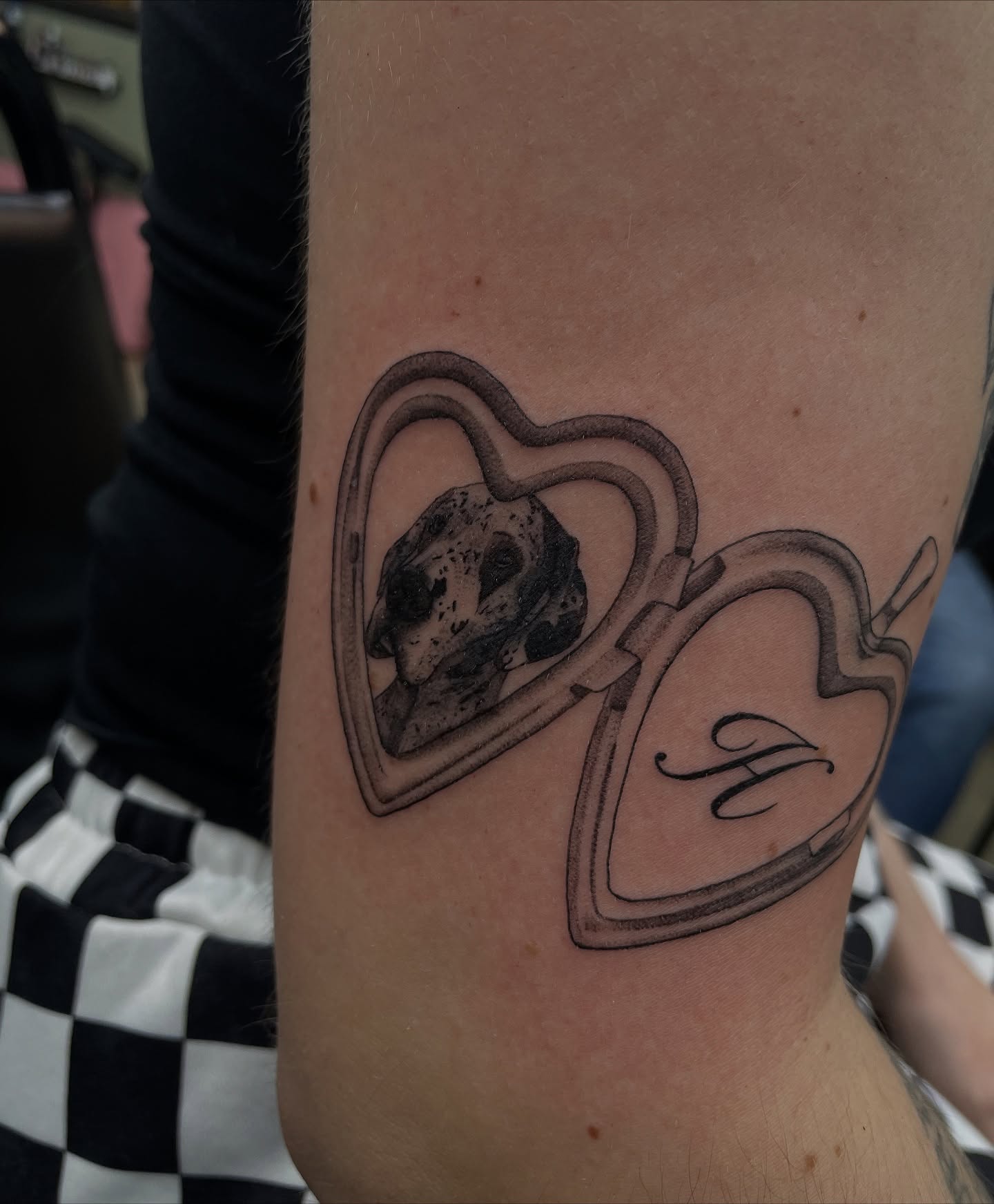 Skull in heart black and grey tattoo on the forearm by kaylee