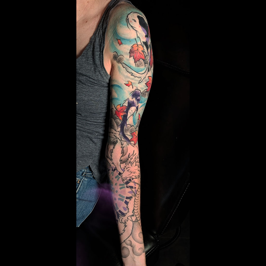Dragon and leaves American traditional tattoo on the forearm by Dave Chercourt, Willoughby, Ohio