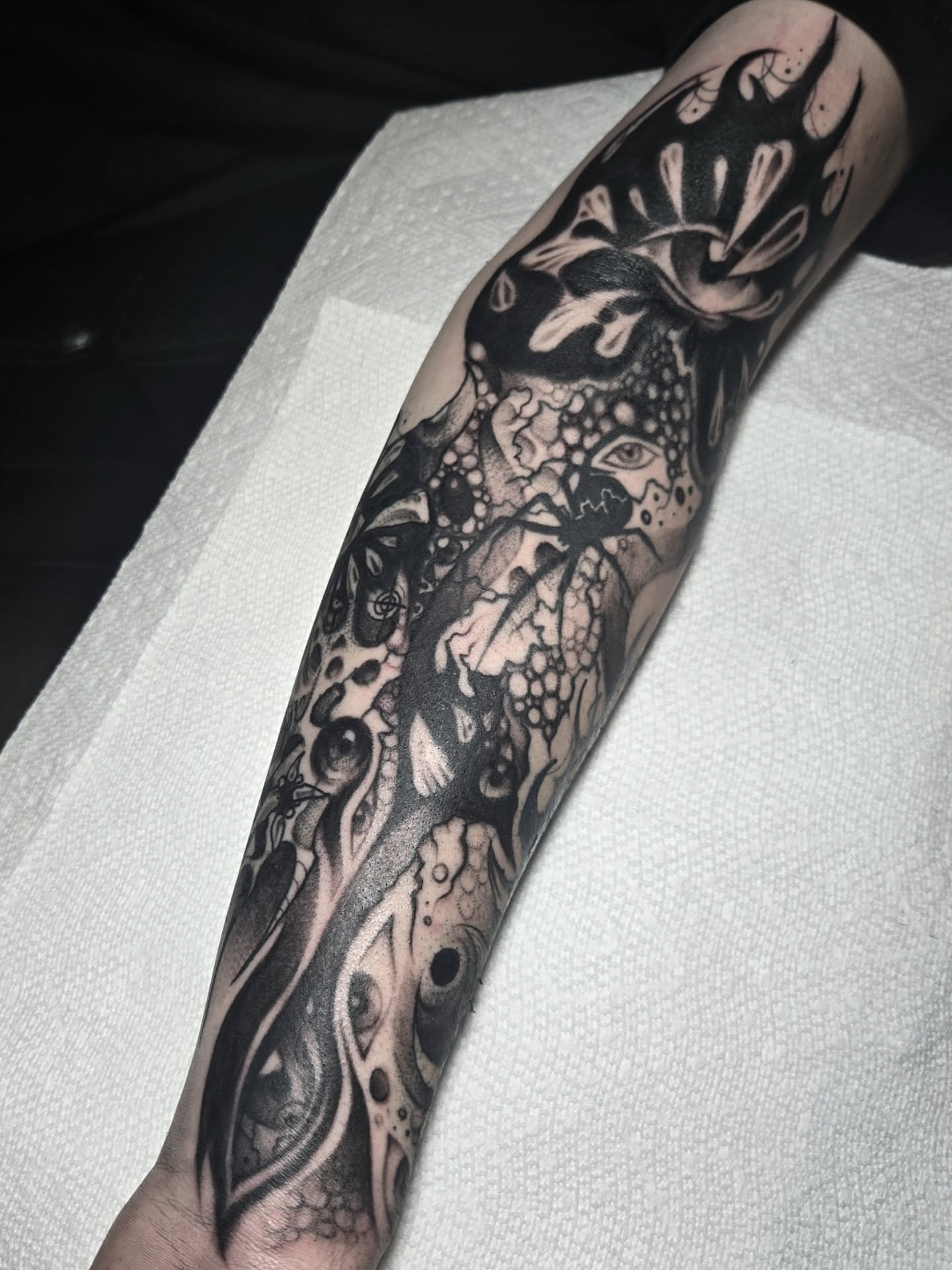 Abstract surrealism surrealism tattoo on the forearm by Ema Fish