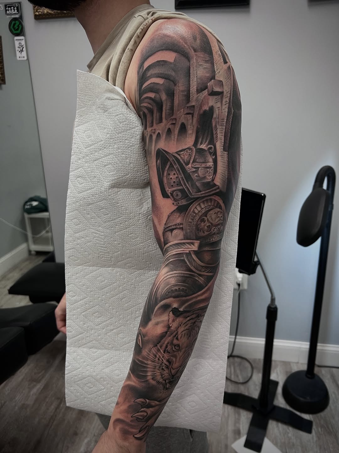 Gladiator helmet and tiger realism tattoo on the forearm by Daniel Fisher, Berlin, New Jersey