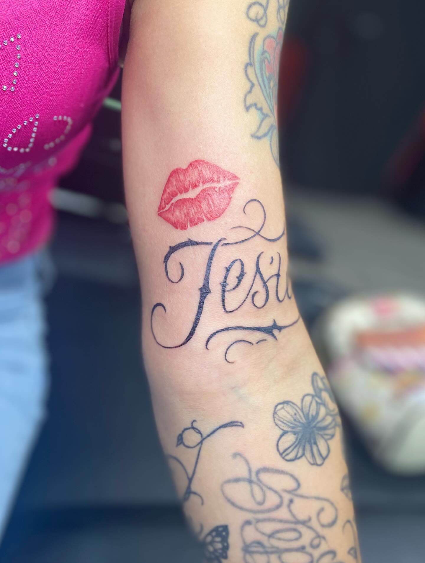 Lips and cursive text lettering script tattoo on the forearm by MD Ariel🦷