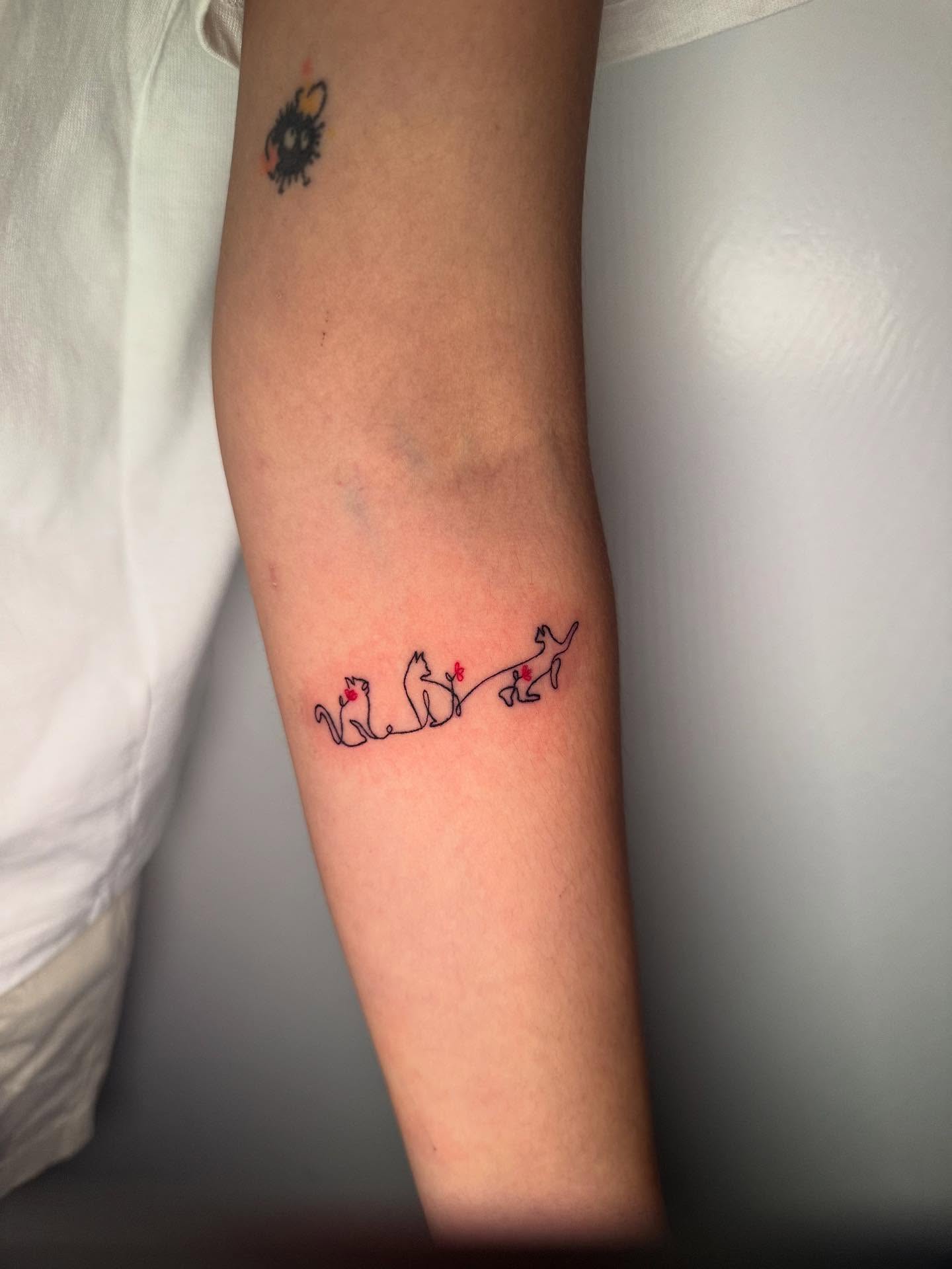 Three cats fine line tattoo on the forearm by dotMX