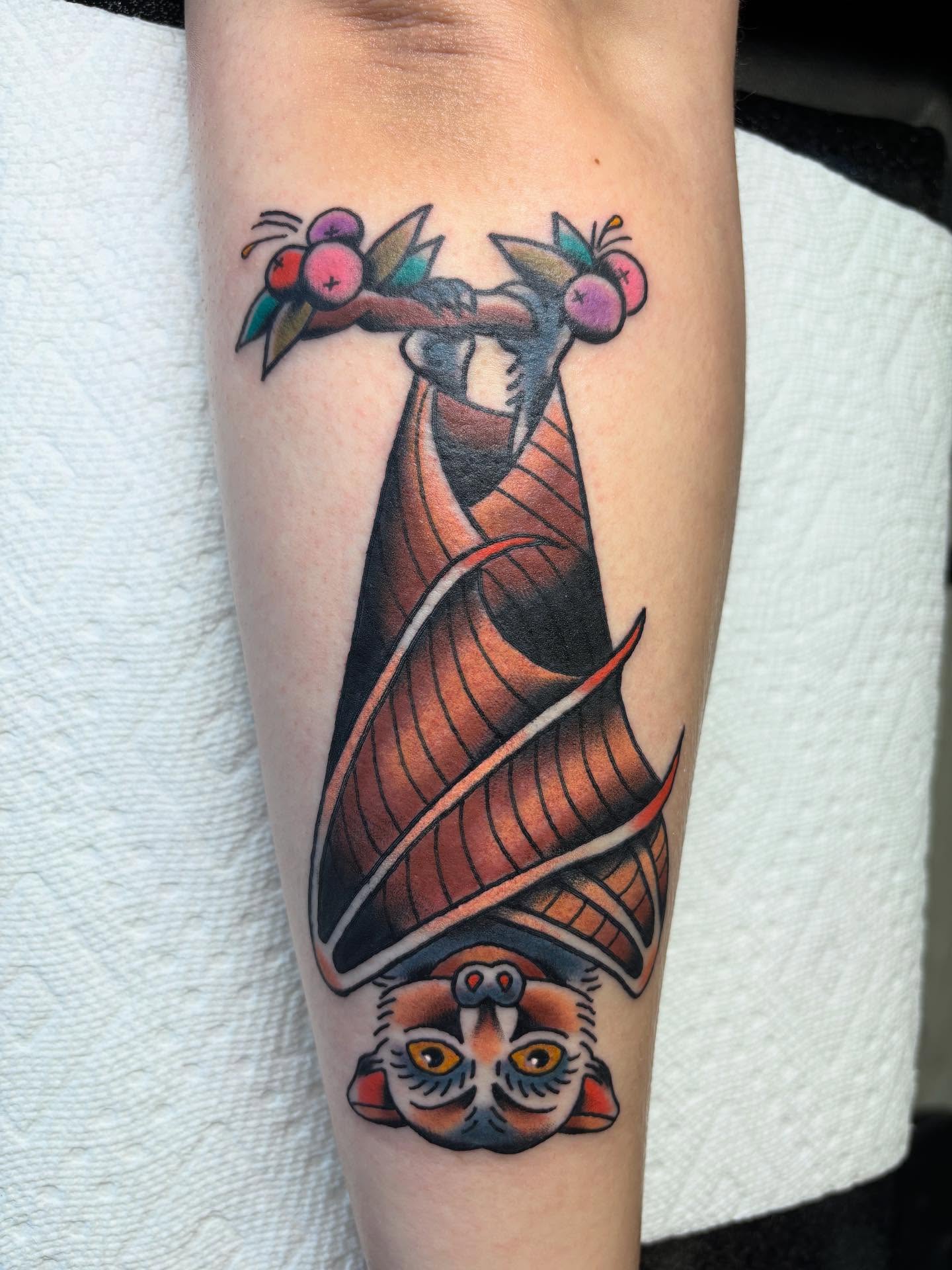 Bat with fruit American traditional tattoo on the forearm by Ben Whyte