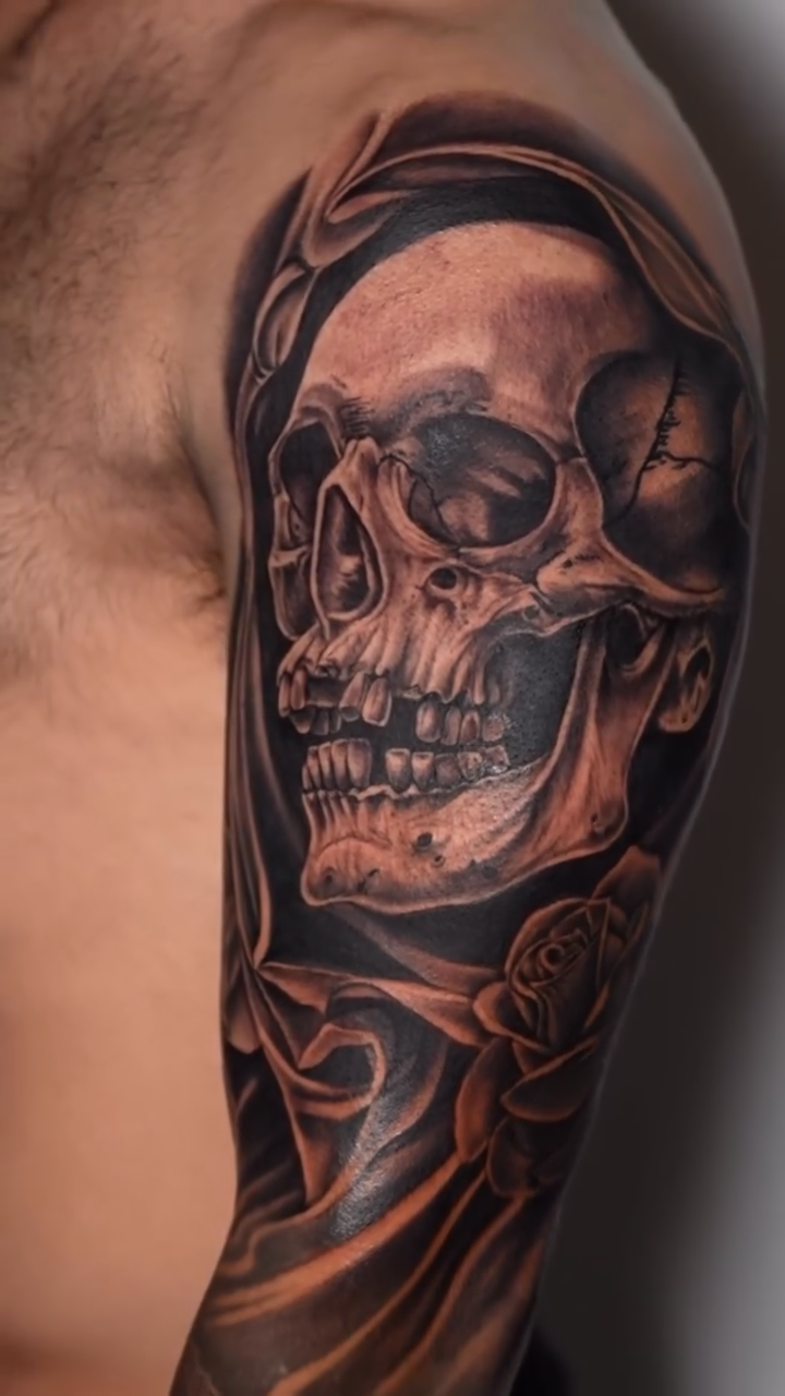 Skull with roses realism tattoo by Dharma.tattoo