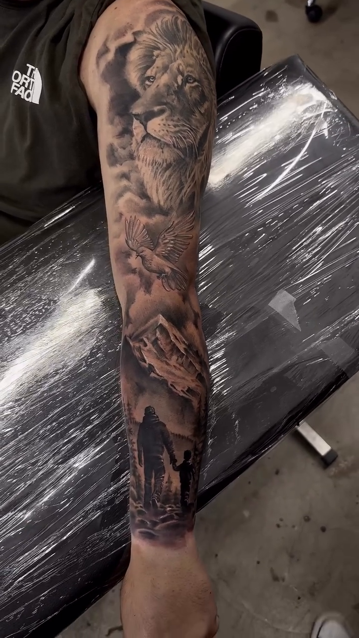 Lion and silhouette figures realism tattoo by Nance⚡