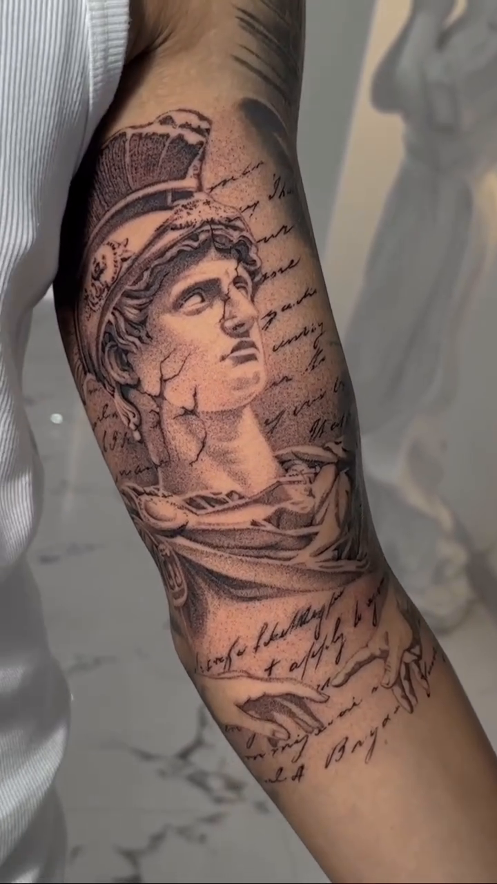 Bust of classical figure and script realism tattoo by Viktor Govorukhin
