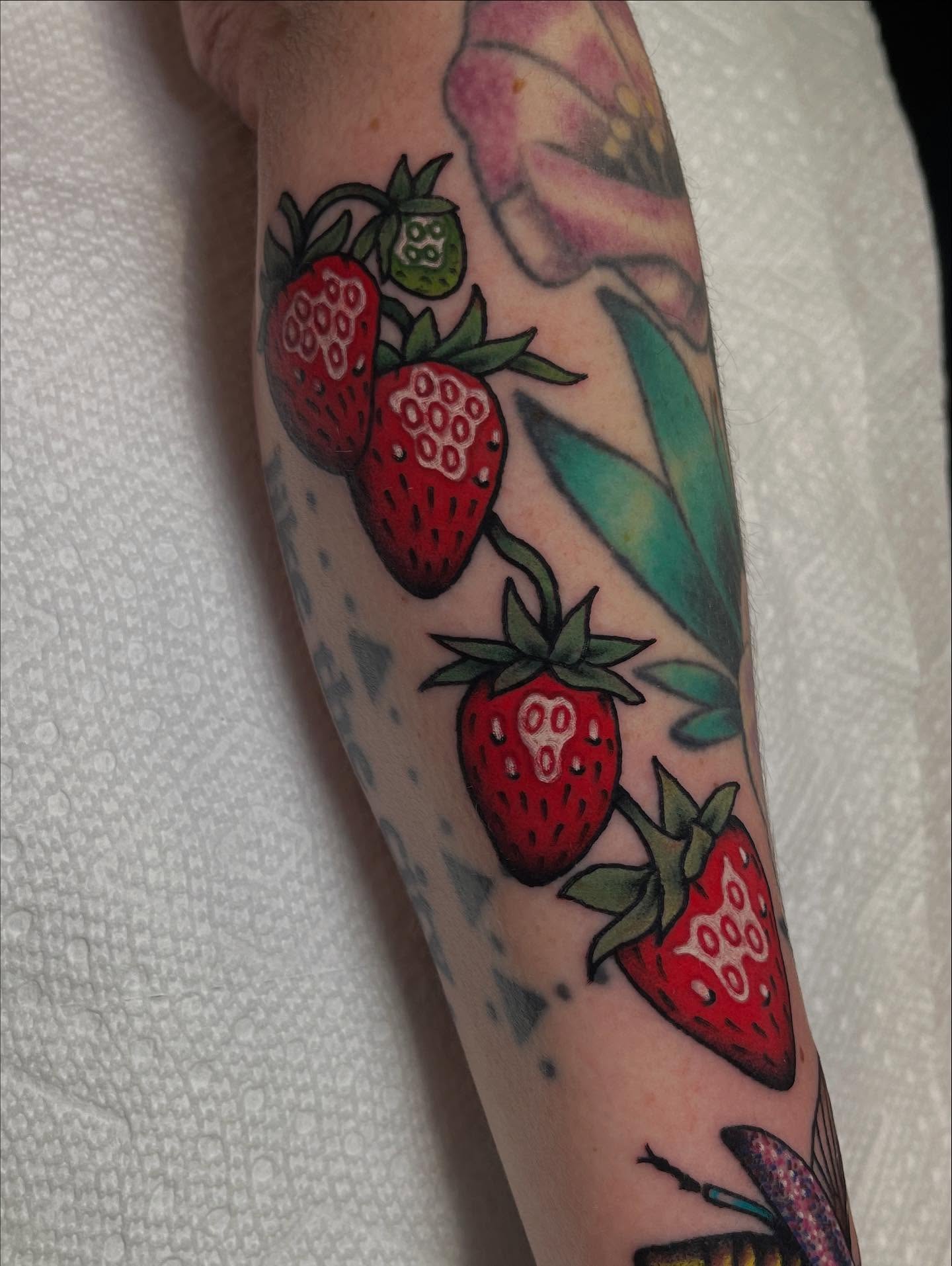 Strawberries American traditional tattoo on the forearm by Marqui Watling