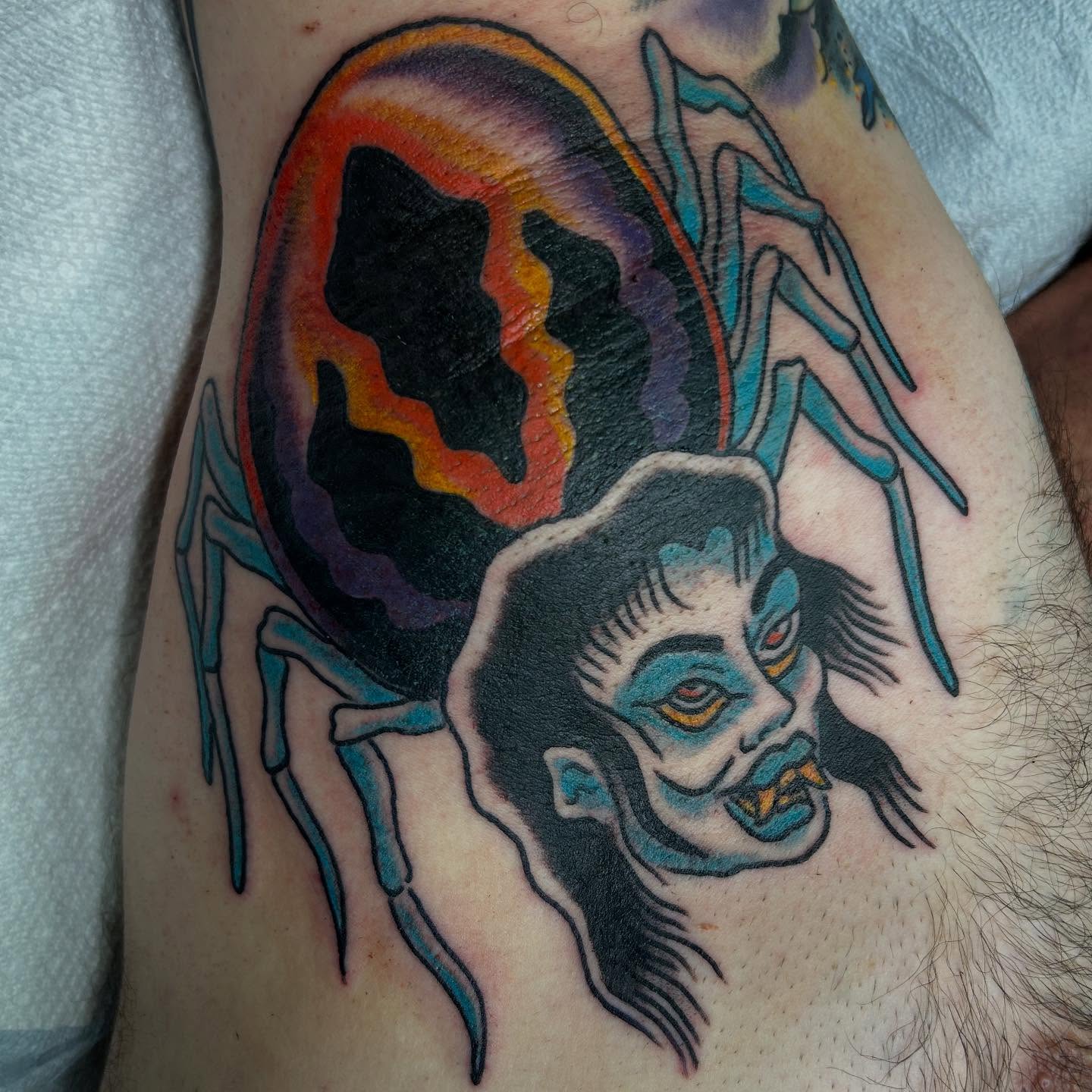 Demon head American traditional tattoo on the thigh by Erin Einhorn