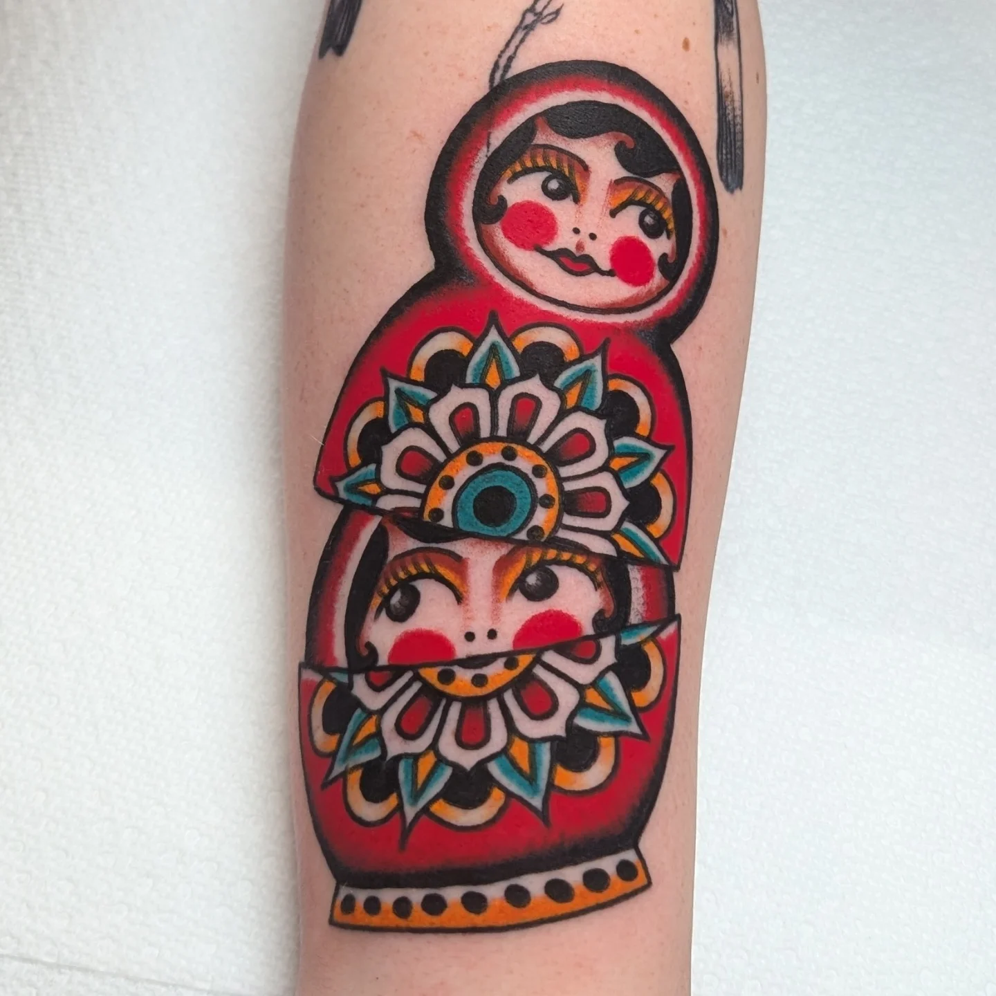 Matryoshka dolls American traditional tattoo on the forearm by Zack Mueller