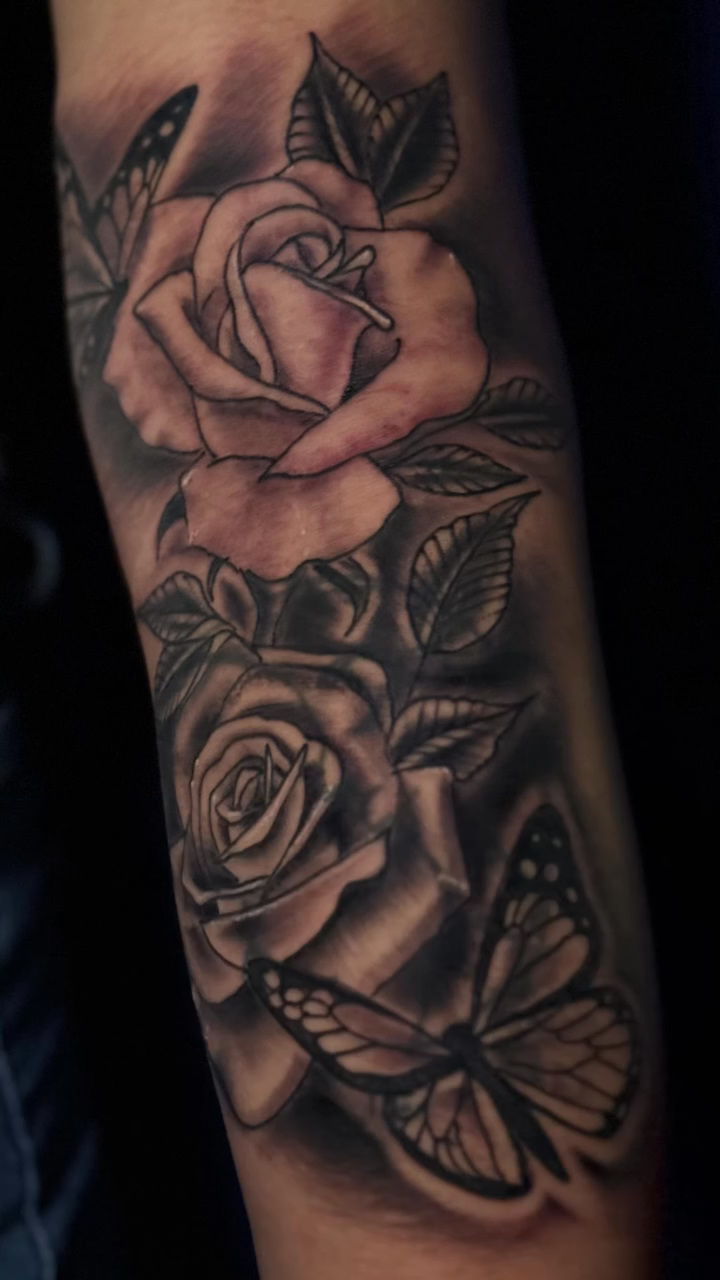 Roses and butterfly realism tattoo by Artist Clayco rikky