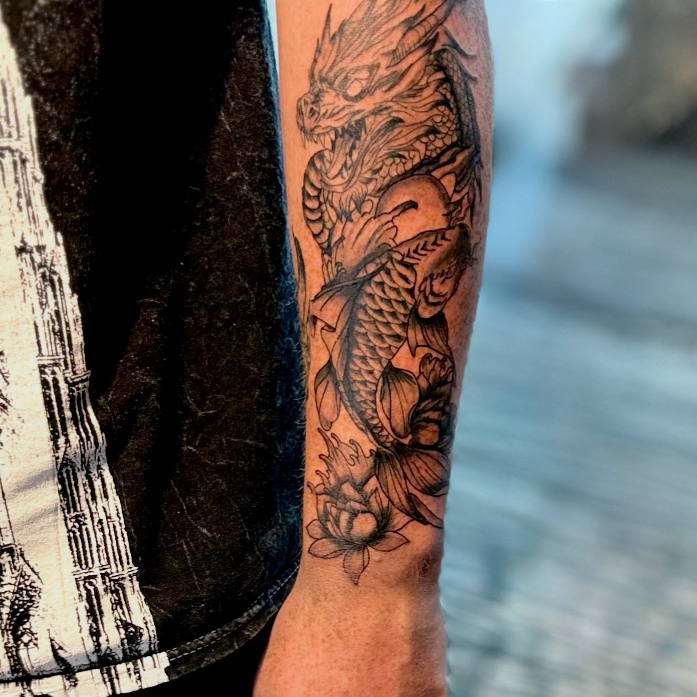 Dragon and koi fish realism tattoo on the forearm by dotMX