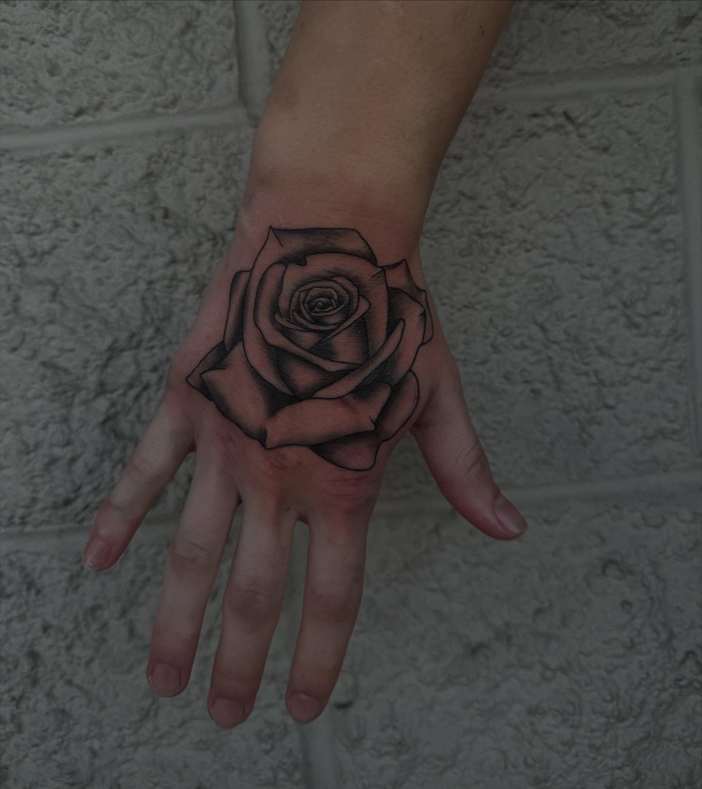 Rose black and grey tattoo on the hand by Kylee langford 🧿