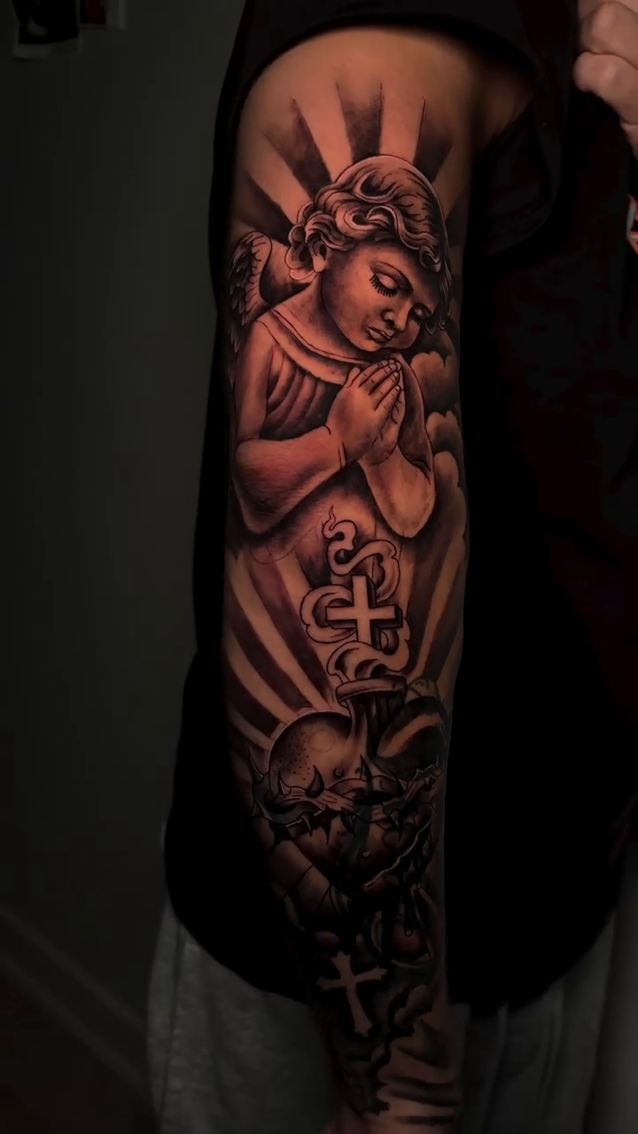 Angel and sacred heart realism tattoo by Thomas