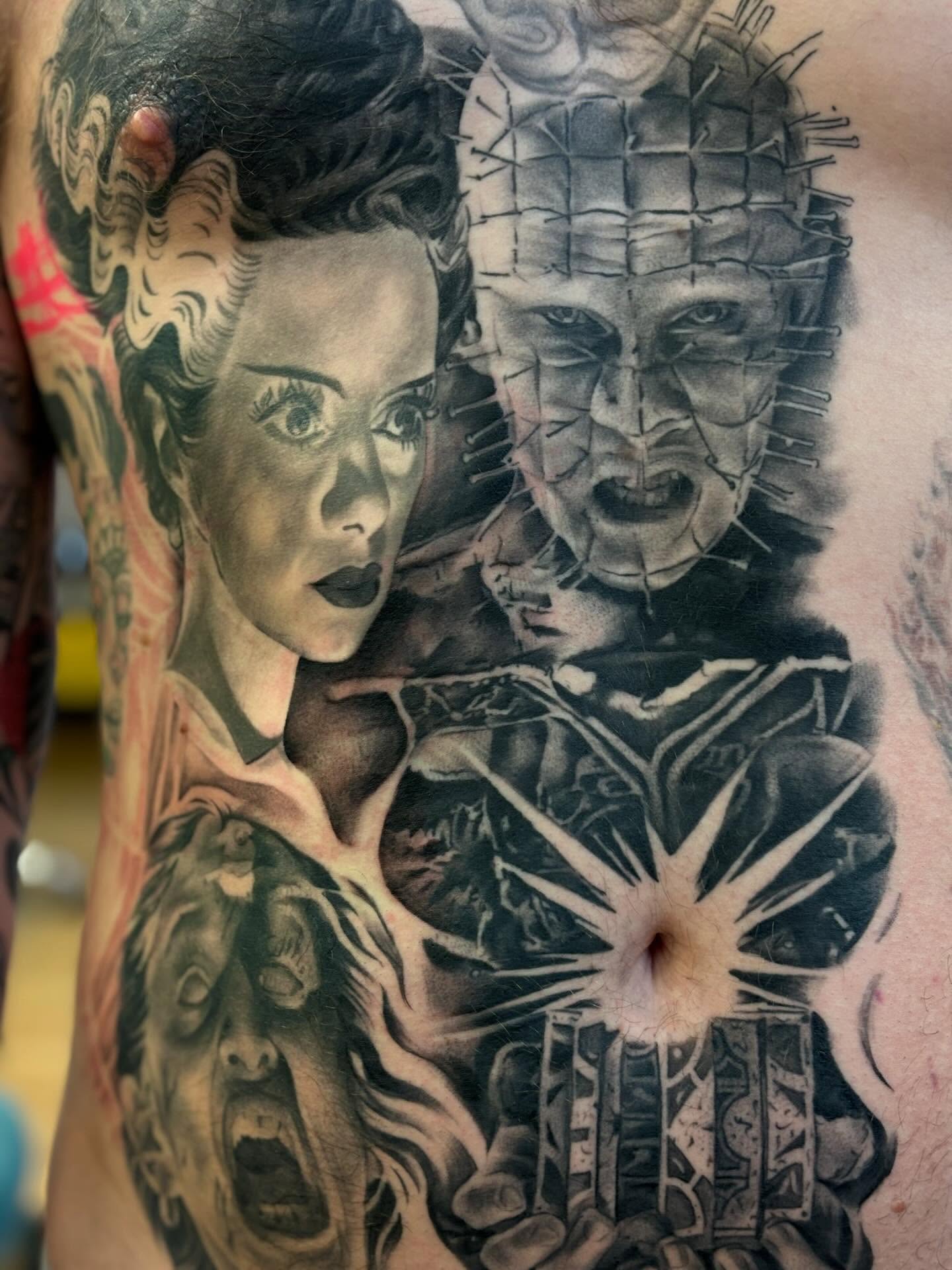Monster and woman realism tattoo on the chest by Storm