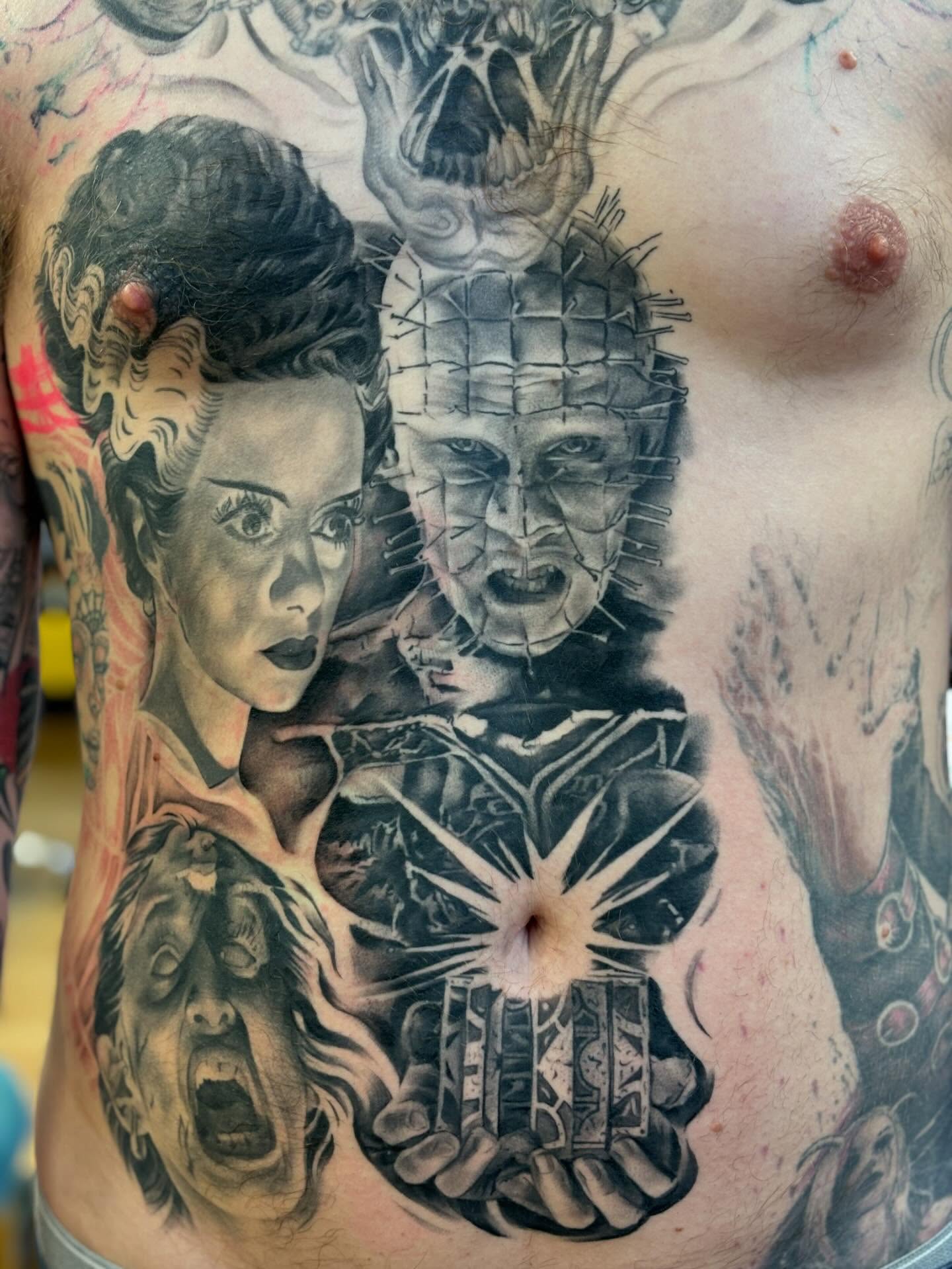 Pinhead and Bride of Chucky realism tattoo on the chest by Storm