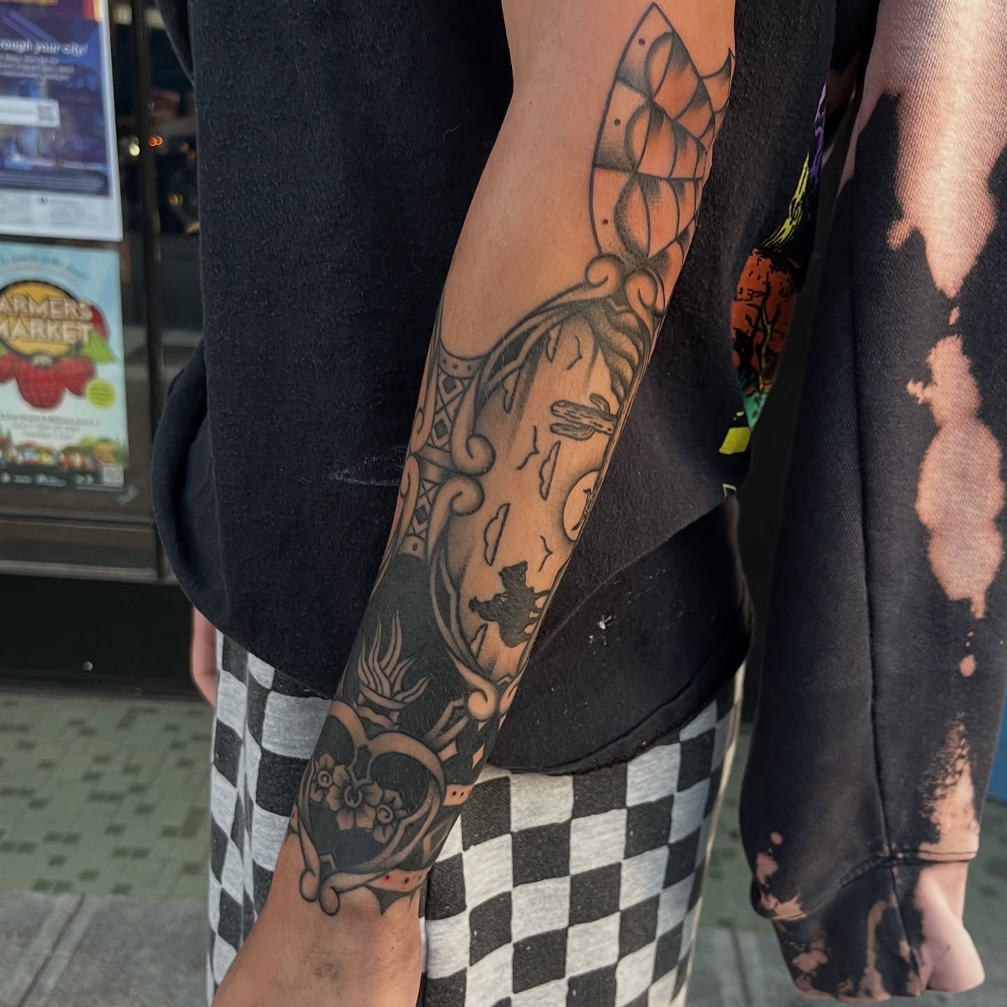 Floral and abstract geometric tattoo on the forearm by August B., Renton, Washington