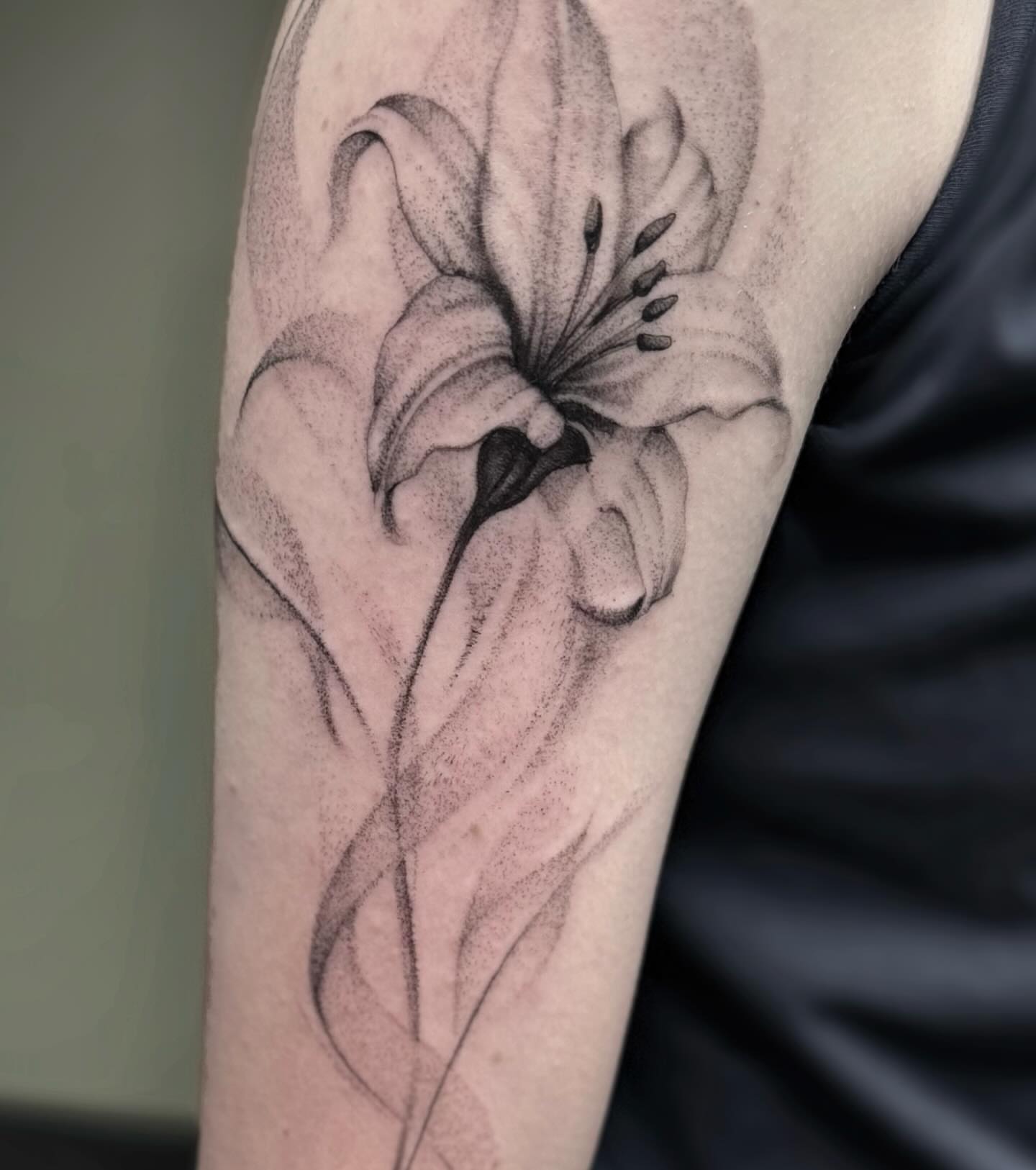 Lily dotwork tattoo on the forearm by Eric Axle
