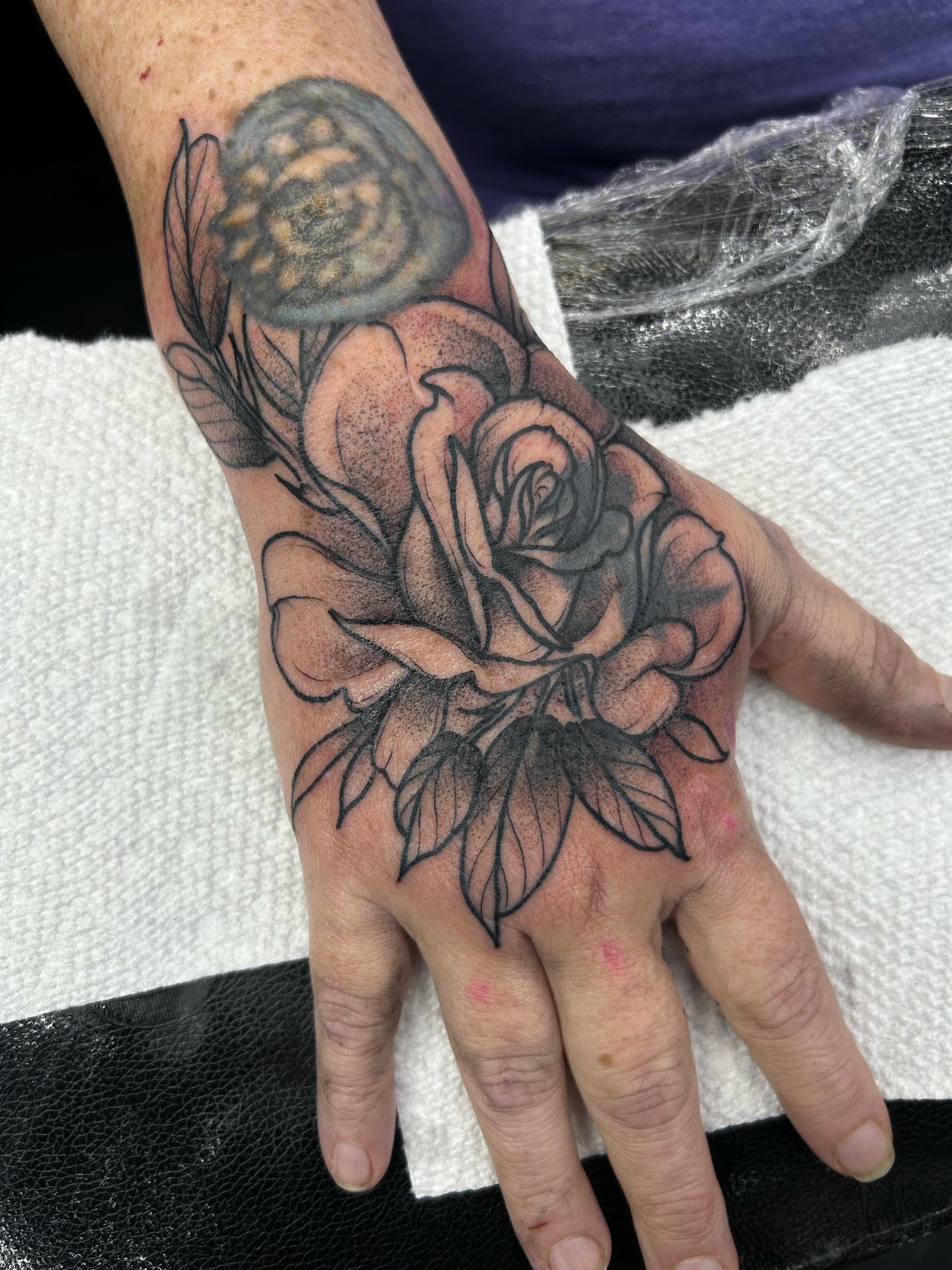 Rose black and grey tattoo on the hand by Tatijana., Kettering, Ohio