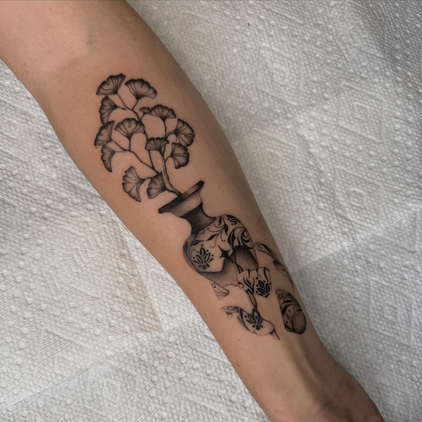 Flower bouquet black and grey tattoo on the forearm by Jas Knight