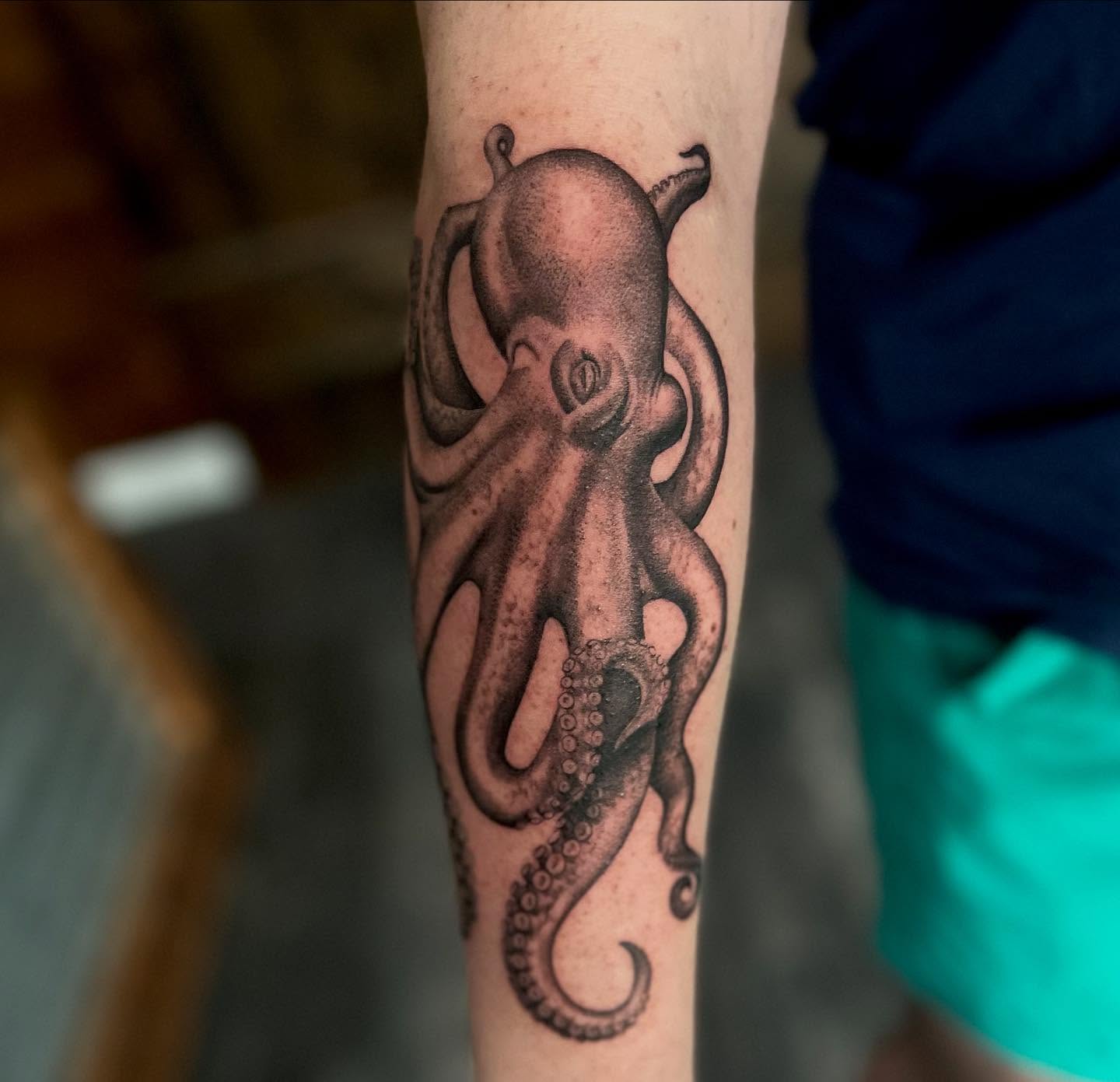 Octopus realism tattoo on the forearm by Lee Ranco