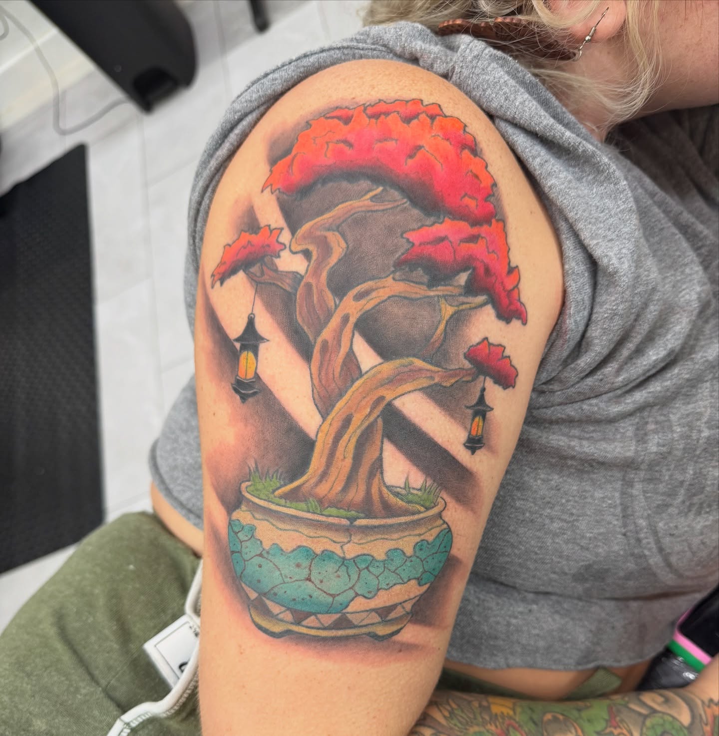 Bonsai tree realism tattoo on the upper arm by James Howell