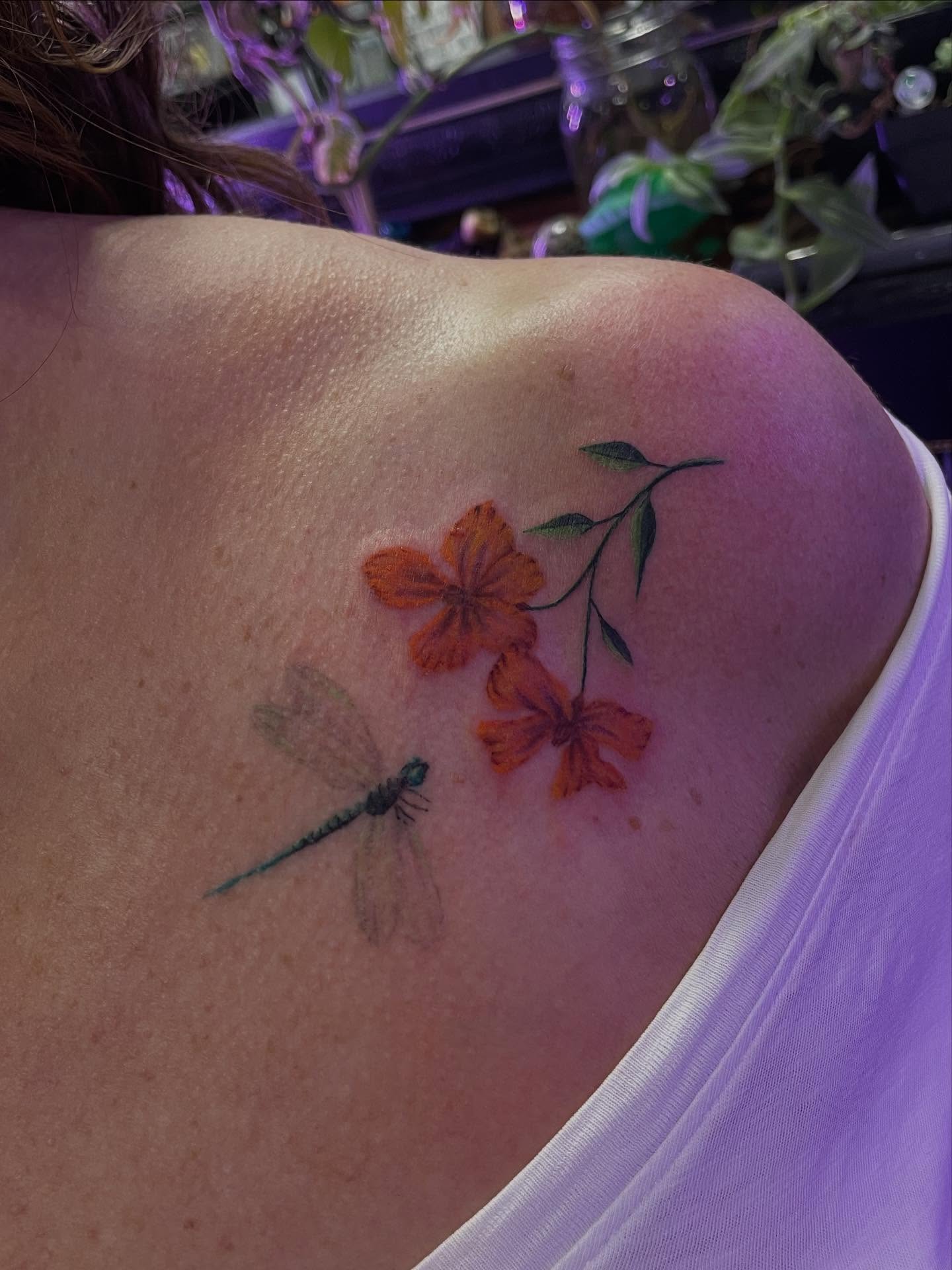 Dragonfly and flowers realism tattoo on the shoulder by Jenna Fraticelli, Monroeville, Pennsylvania