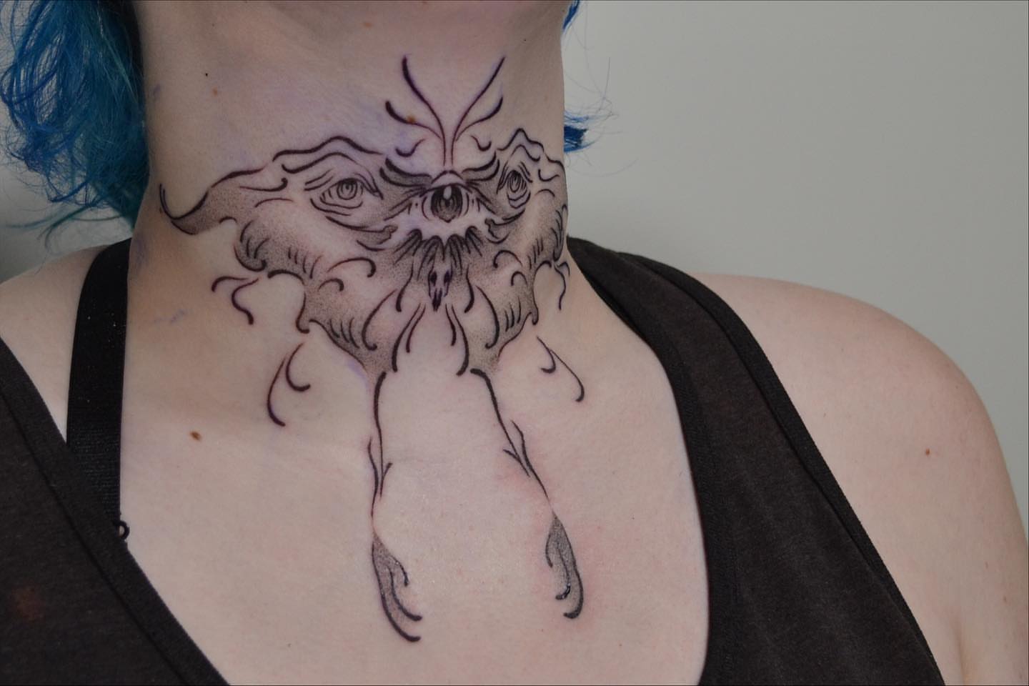 Owl black and grey tattoo on the neck by Vanessa Acosta