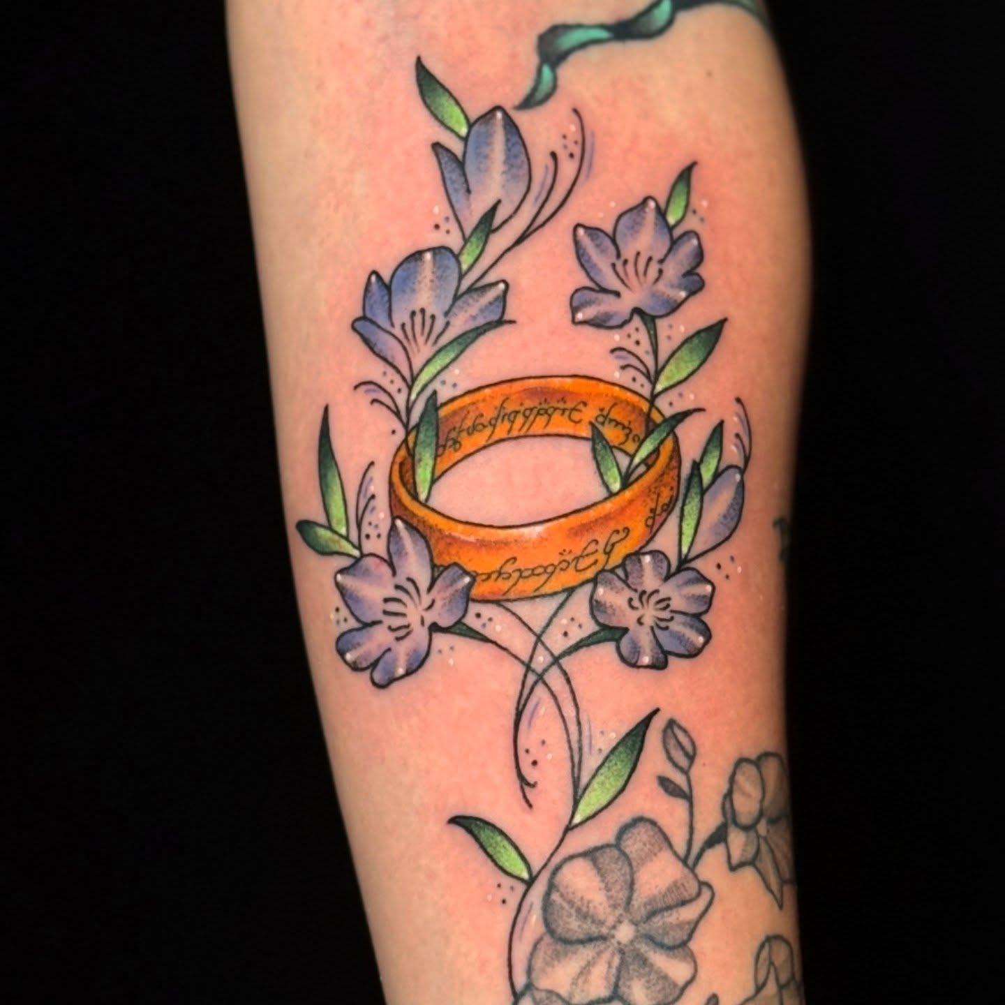 Elven ring and flowers dotwork tattoo on the forearm by Adison Essig