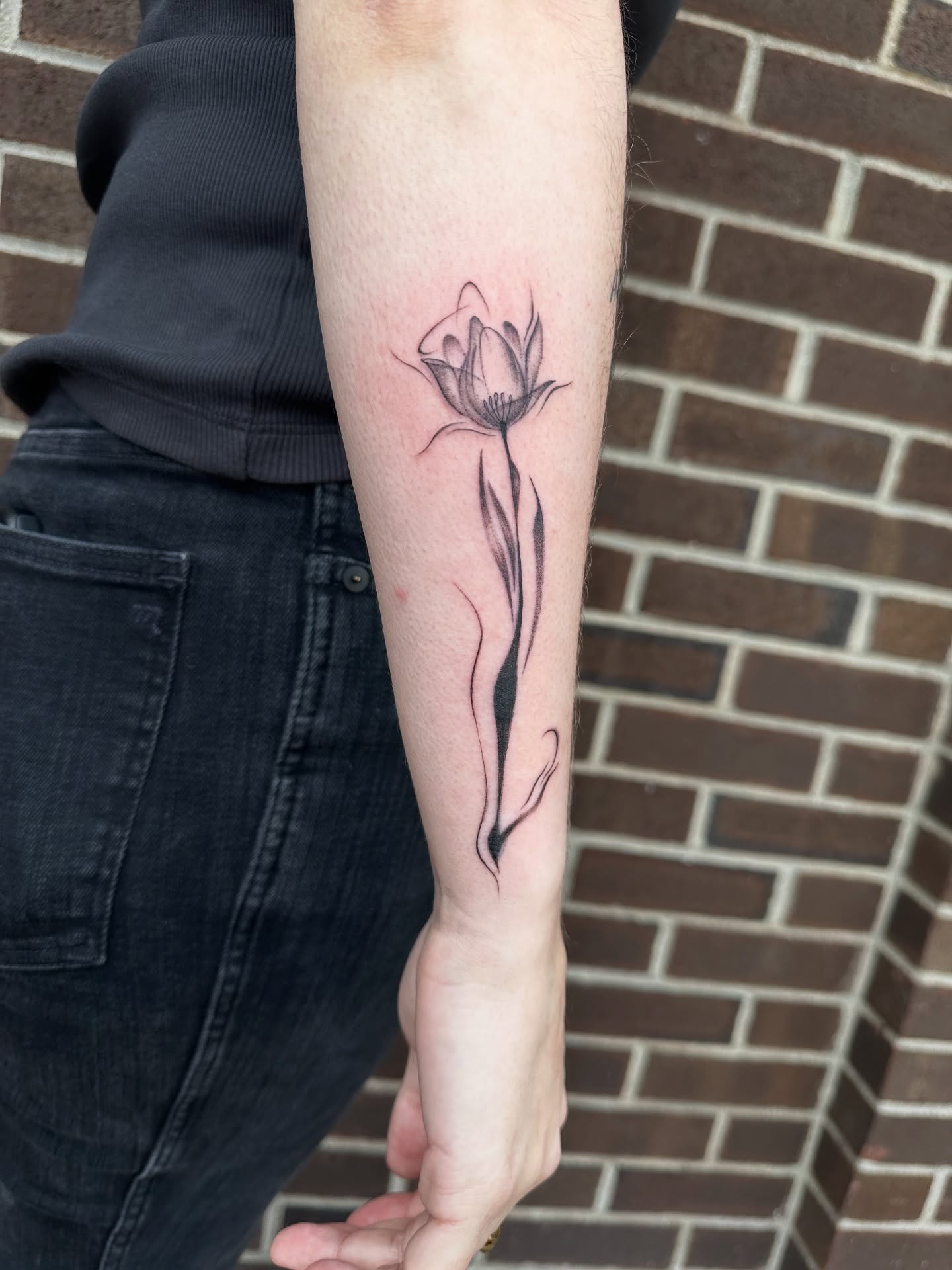 Flower black and grey tattoo on the forearm by Hail Chaney, Somerville, Massachusetts