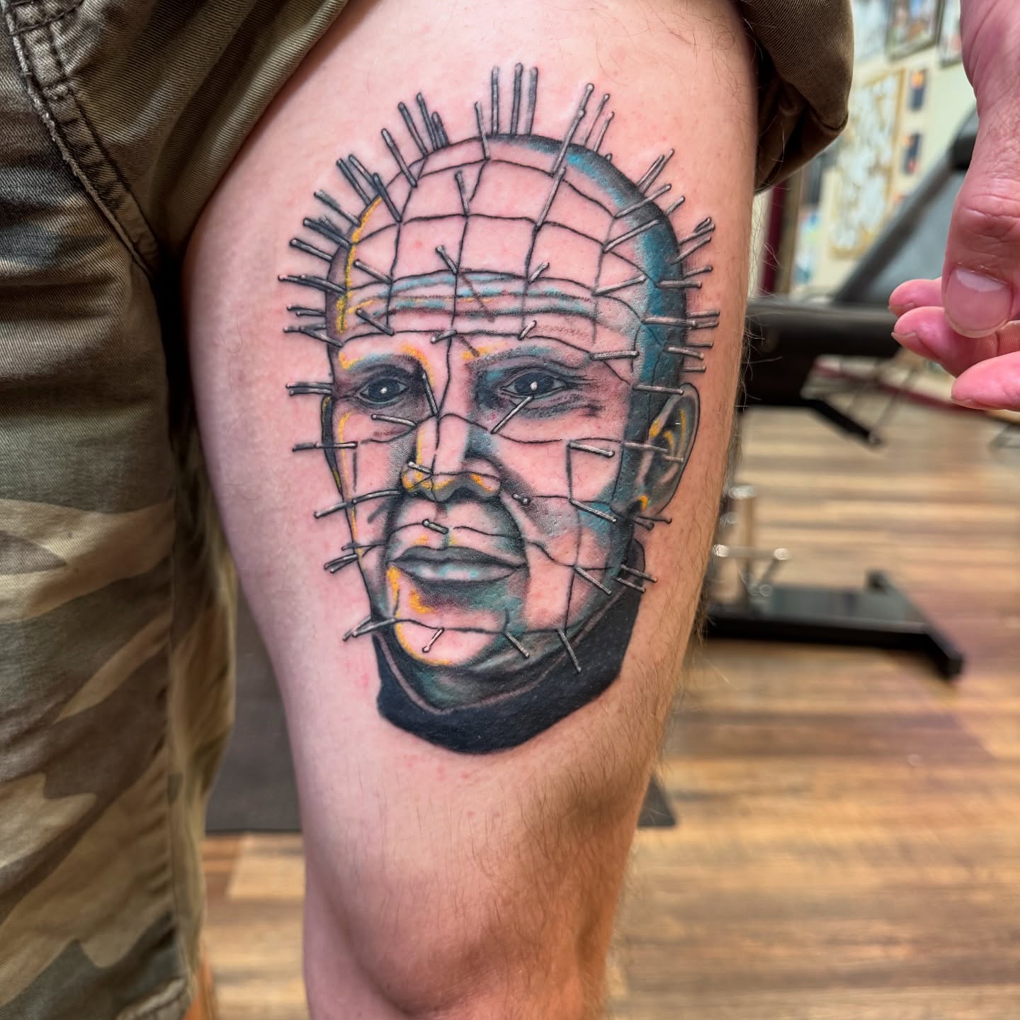 Pinhead realism tattoo on the thigh by Erin Moore