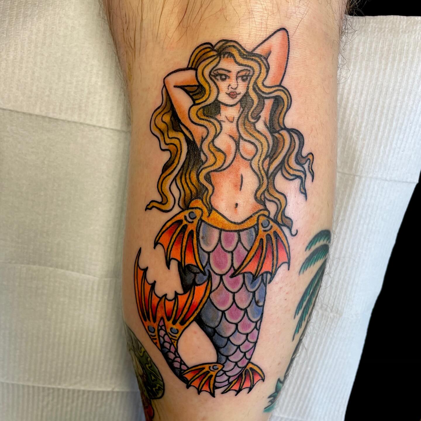 Mermaid American traditional tattoo on the forearm by Jessi Kilpatrick