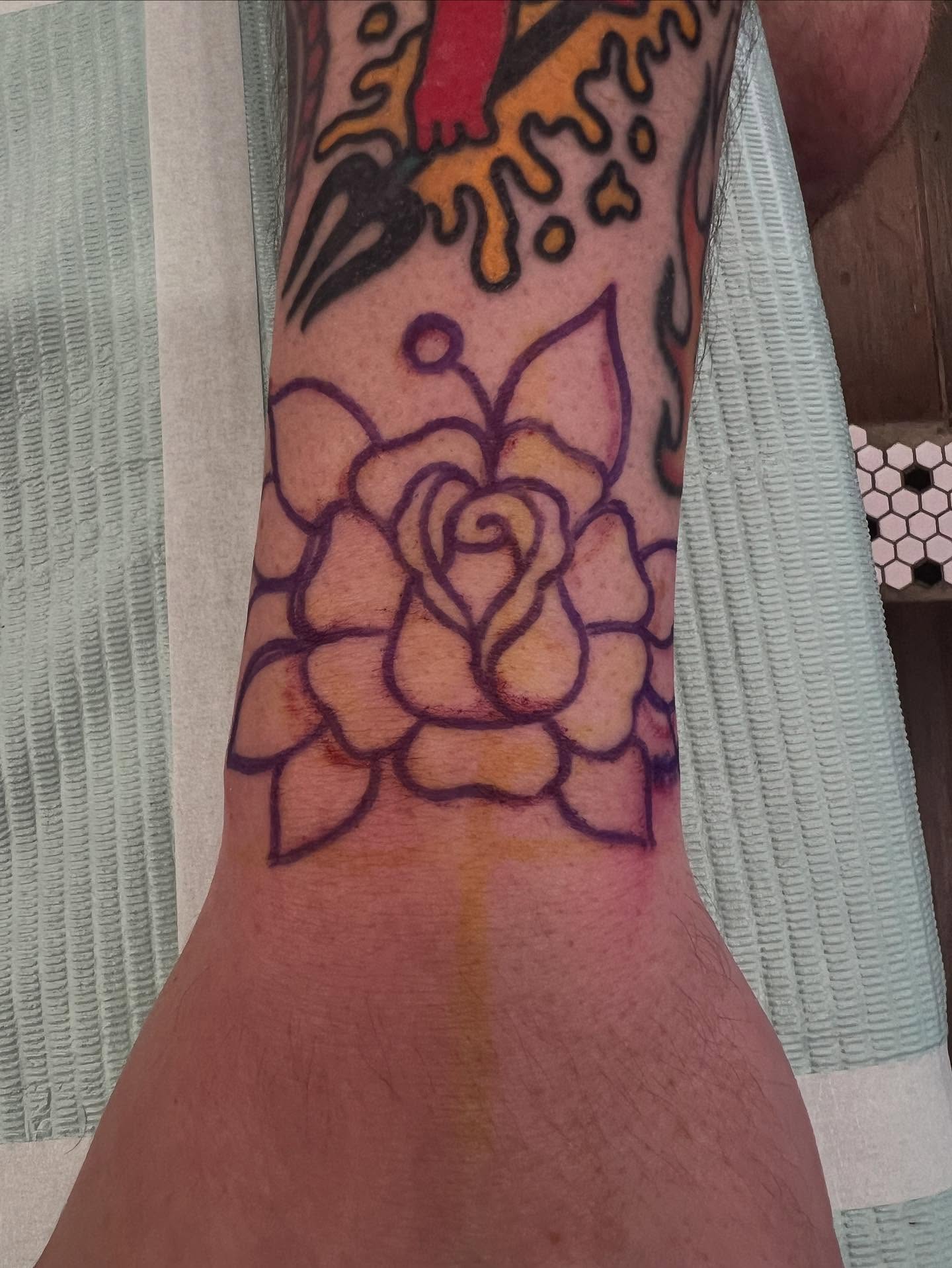 Rose American traditional tattoo on the forearm by Kevin Caruso