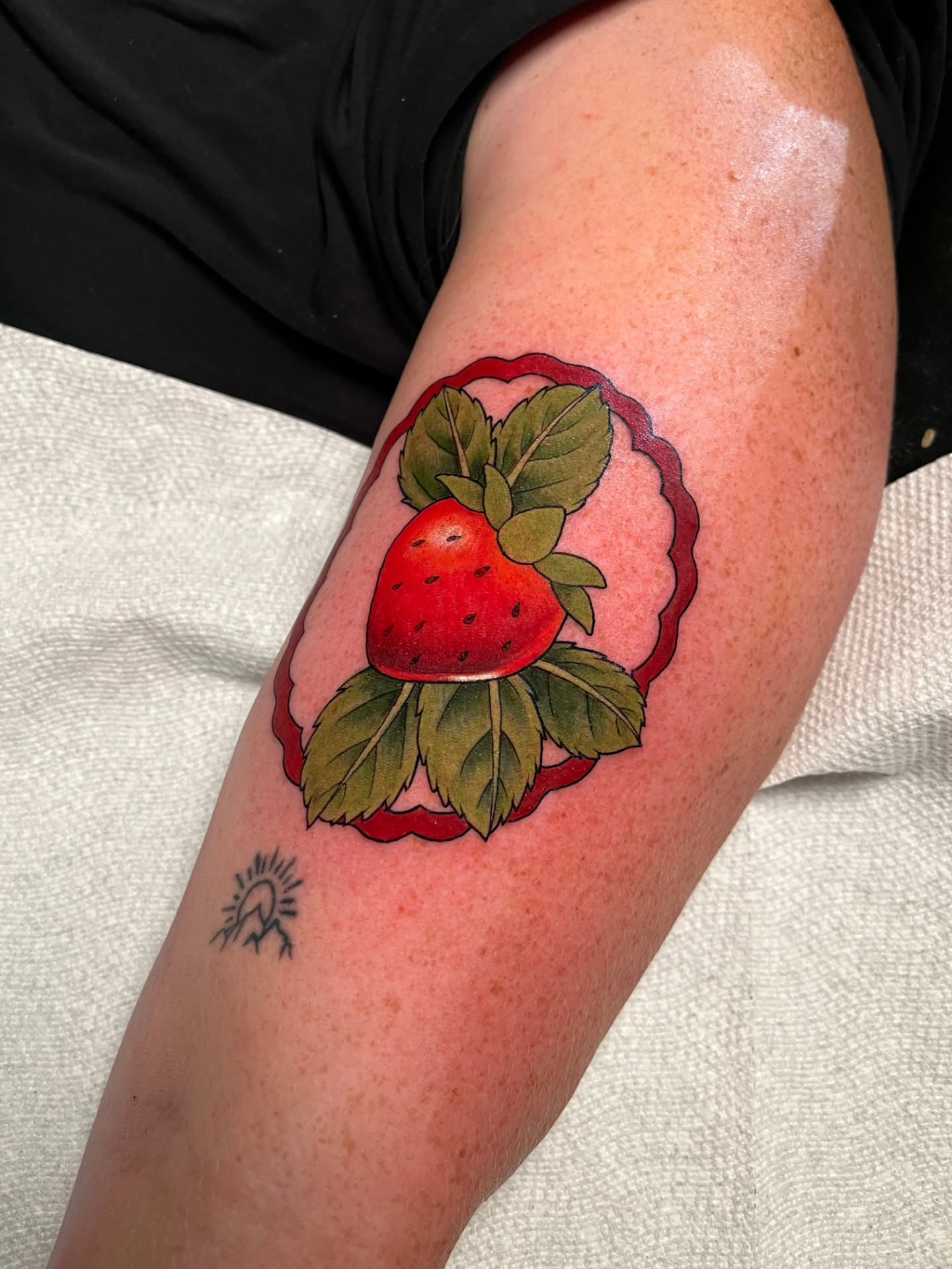 Strawberry American traditional tattoo on the forearm by Summer Machelle, Orange, California