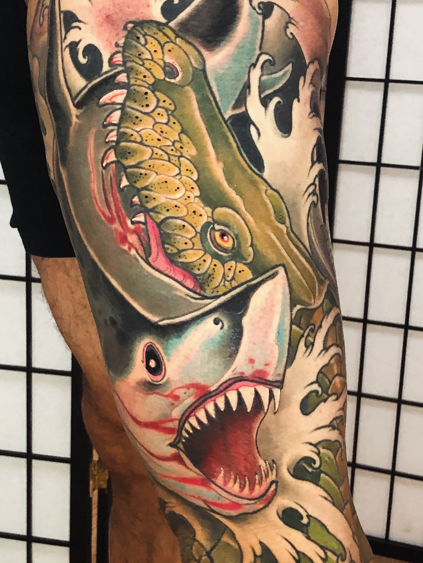 Shark American traditional tattoo on the upper arm by Jon Mesa