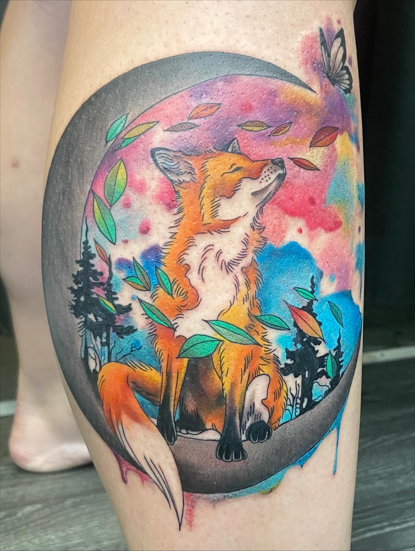 Fox watercolor tattoo on the thigh by Erin McGloin