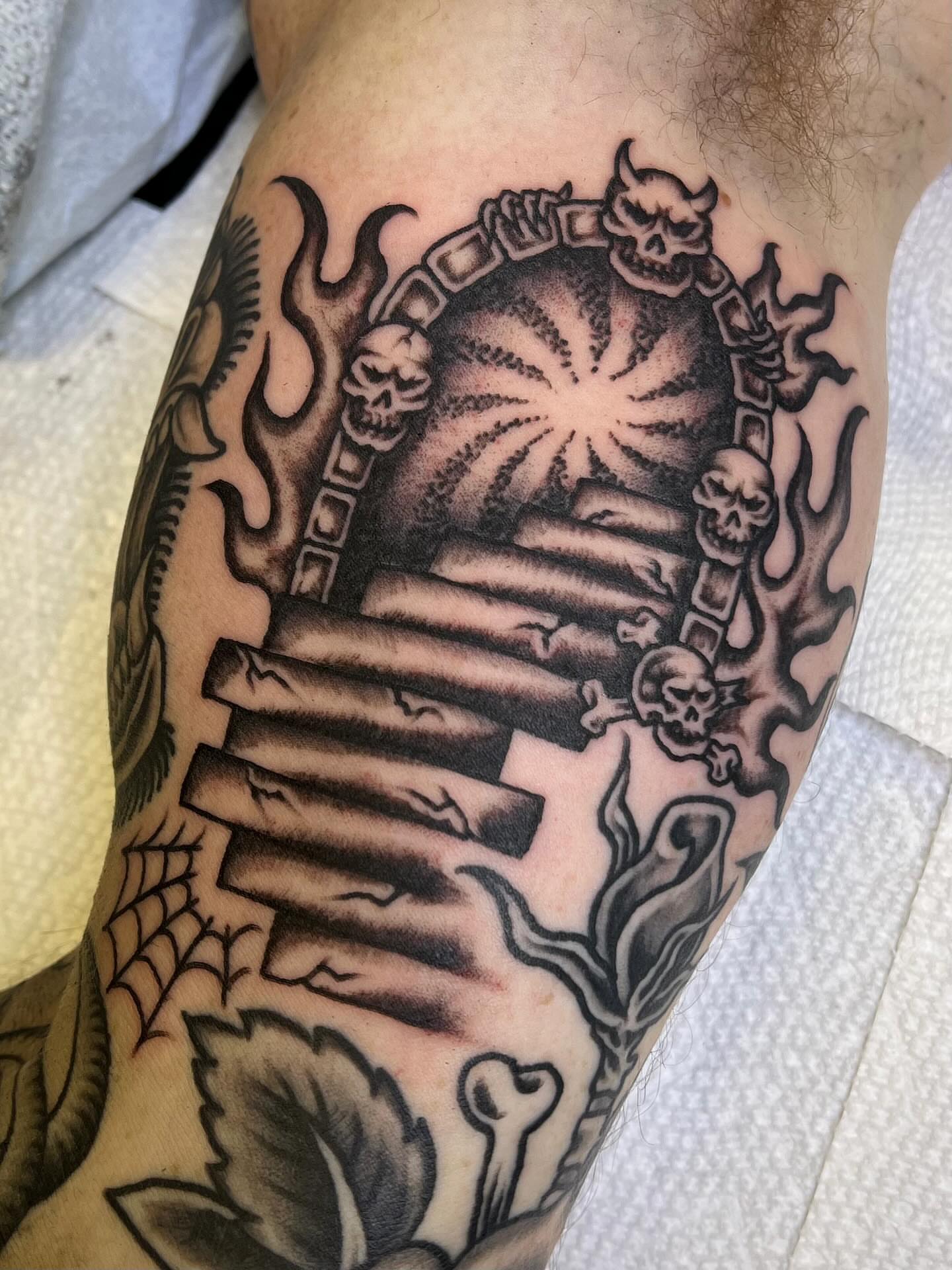 Staircase with skulls black and grey tattoo on the forearm by ⛓ Emily ⚔️ Milja ⛓