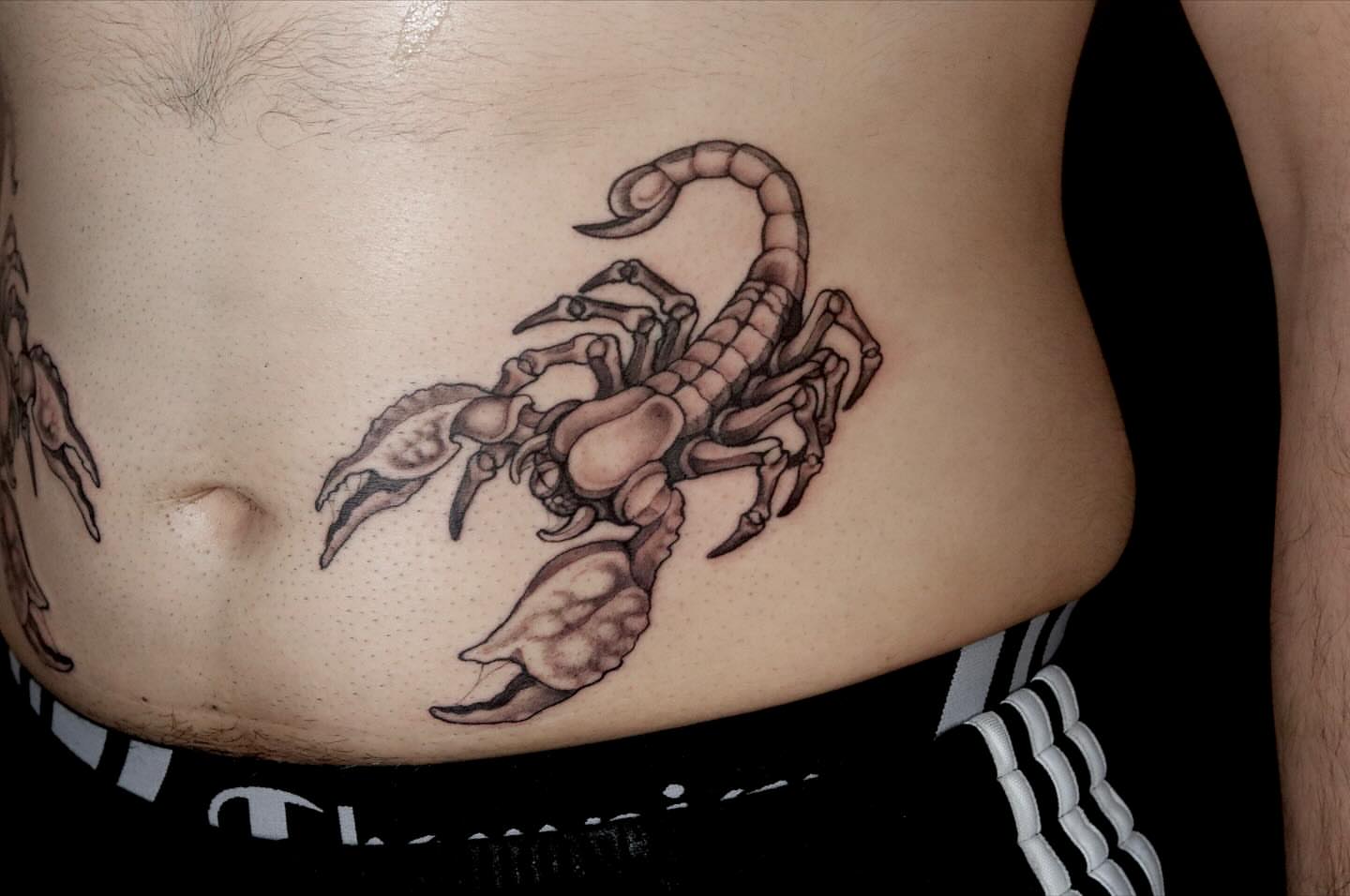 Scorpion black and grey tattoo on the torso by Brandon Seven