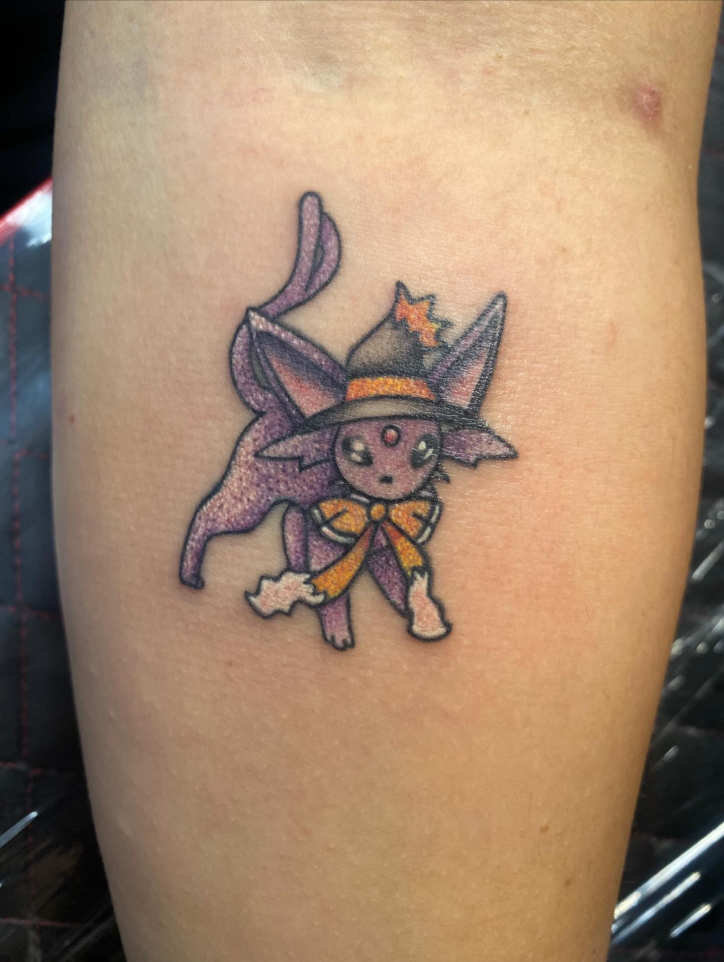 Cat witch anime tattoo on the forearm by Drew