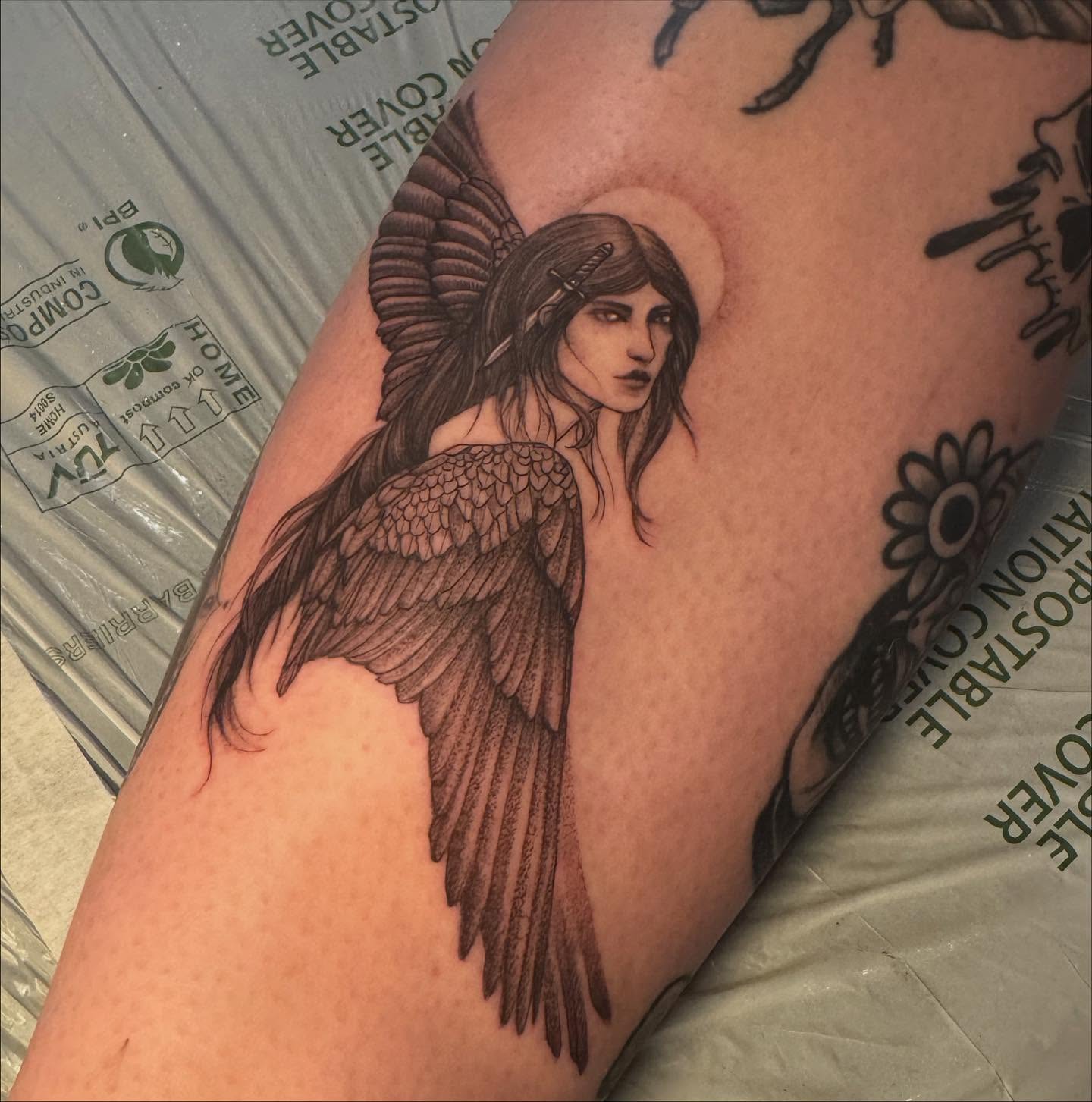 Angel with sword realism tattoo on the thigh by Sarah Seveney