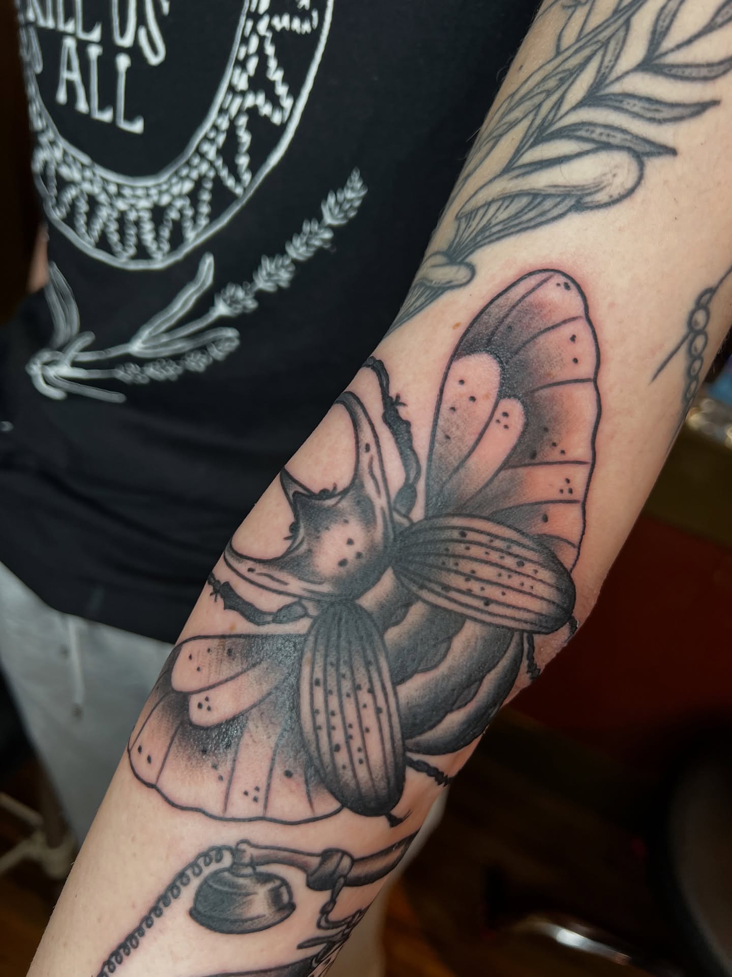 Butterfly black and grey tattoo on the forearm by Cory Miller