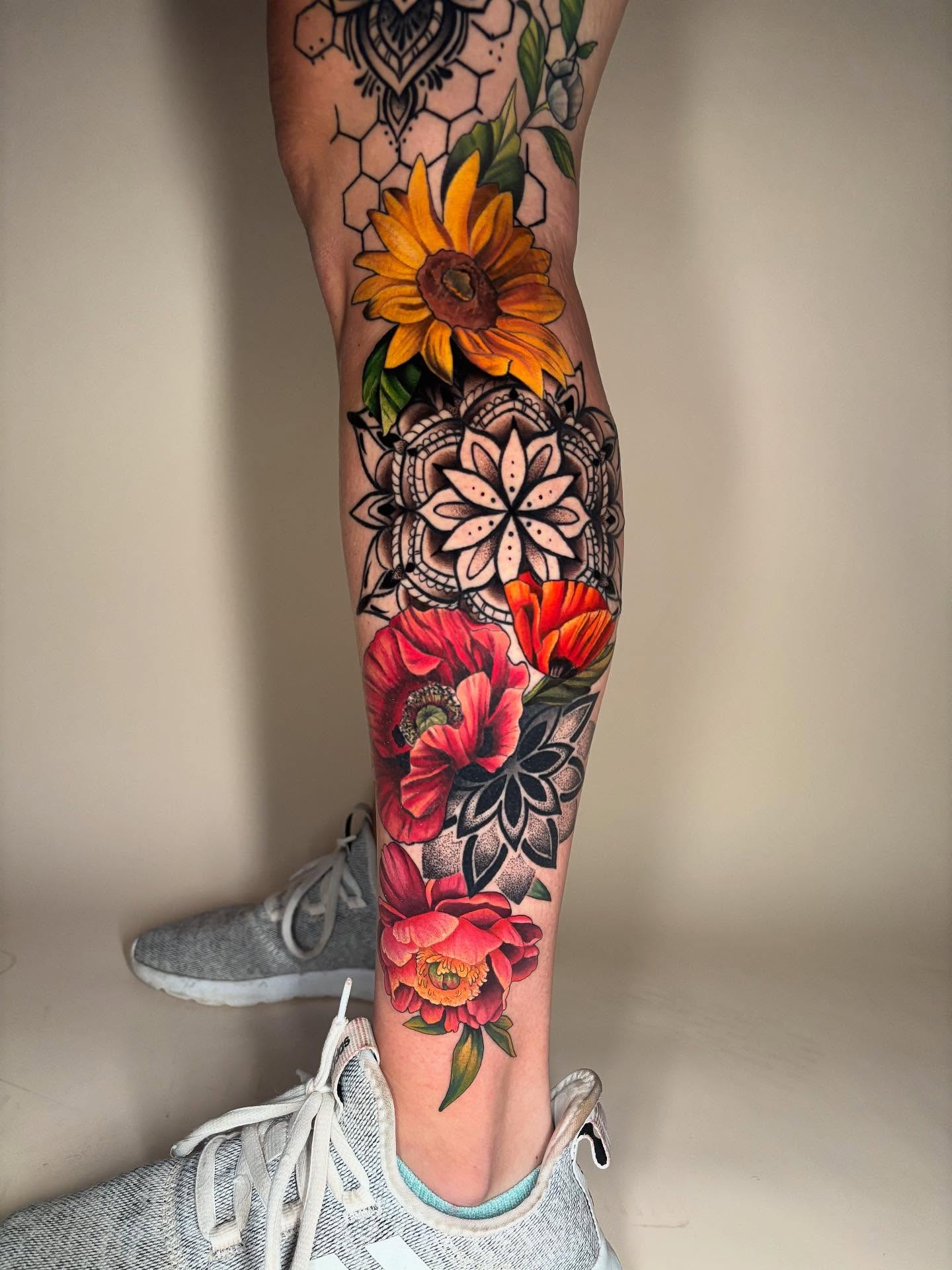 Floral arrangement new school tattoo on the calf by Chelsey Moore, Albuquerque, New Mexico