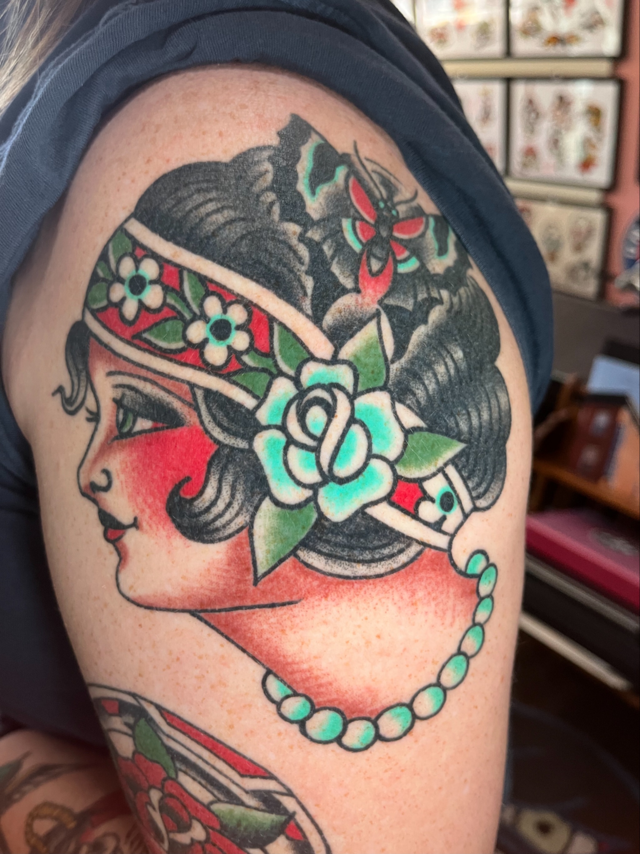 Flapper girl American traditional tattoo on the shoulder by Tim Howell