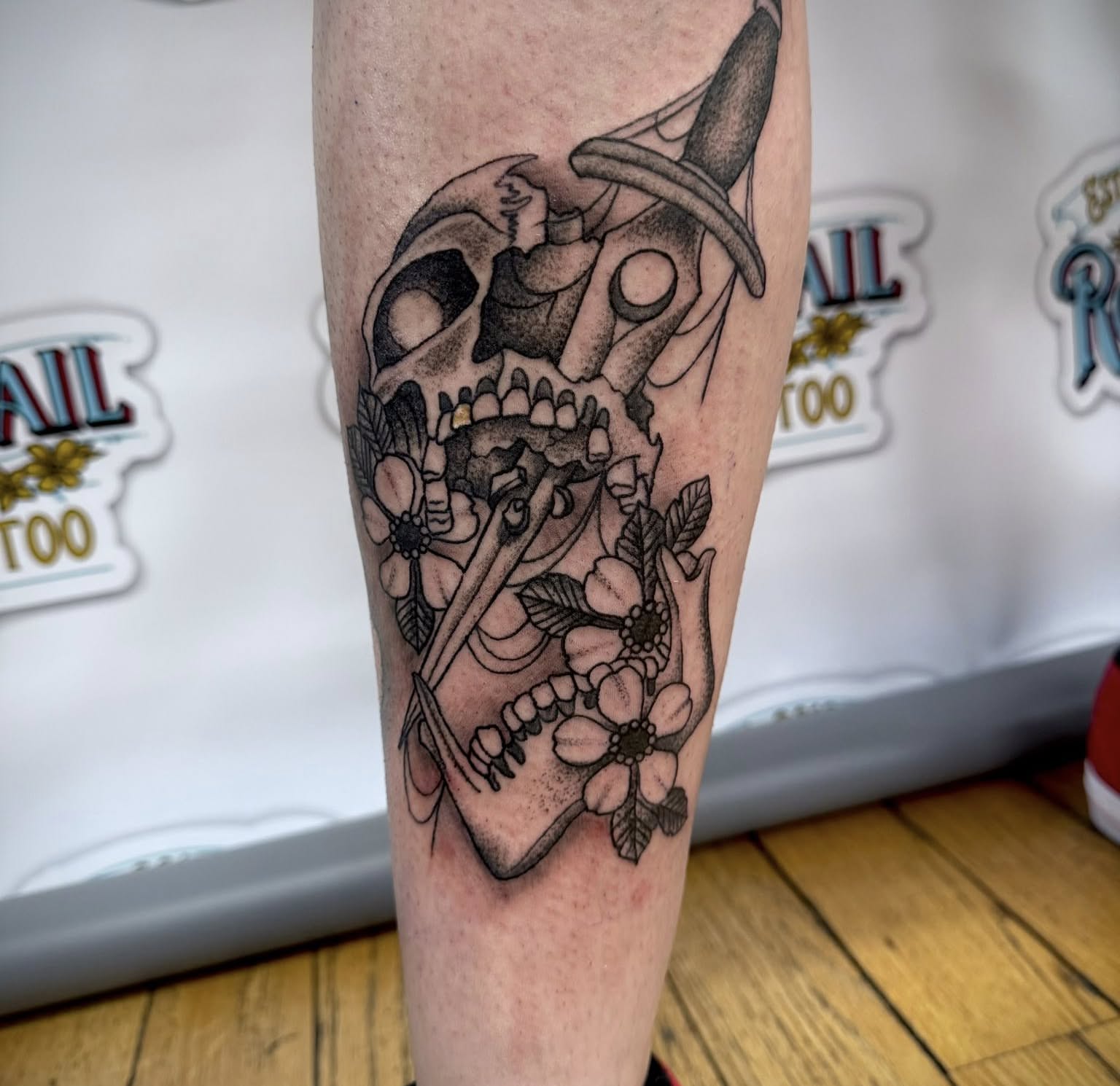 Skull with flowers dotwork tattoo on the forearm by Paul Calhoun Tattoos, Englewood, Ohio