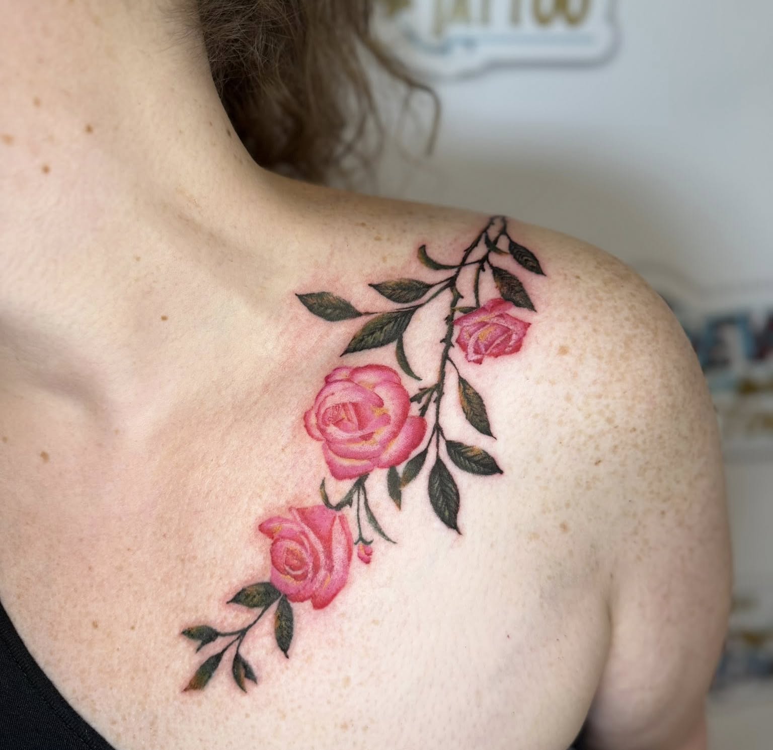 Roses watercolor tattoo on the shoulder by Paul Calhoun Tattoos, Englewood, Ohio