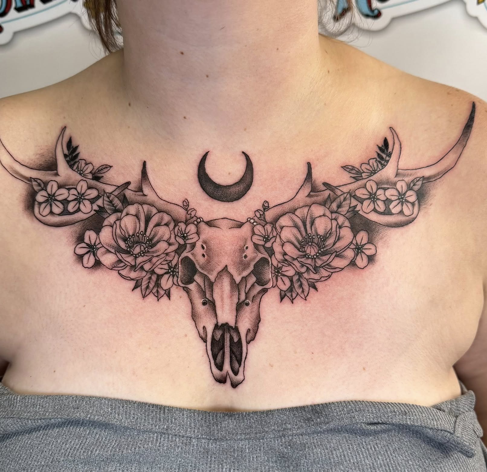 Bull skull with flowers realism tattoo on the chest by Paul Calhoun Tattoos, Englewood, Ohio