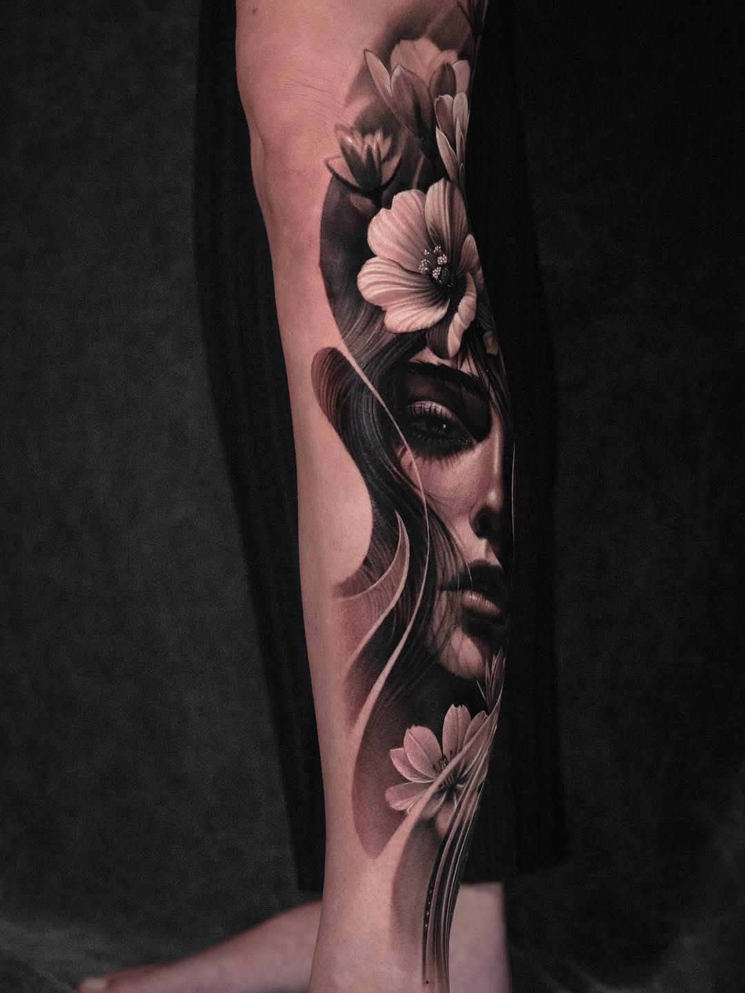 Woman with flowers realism tattoo on the forearm by @_garart_