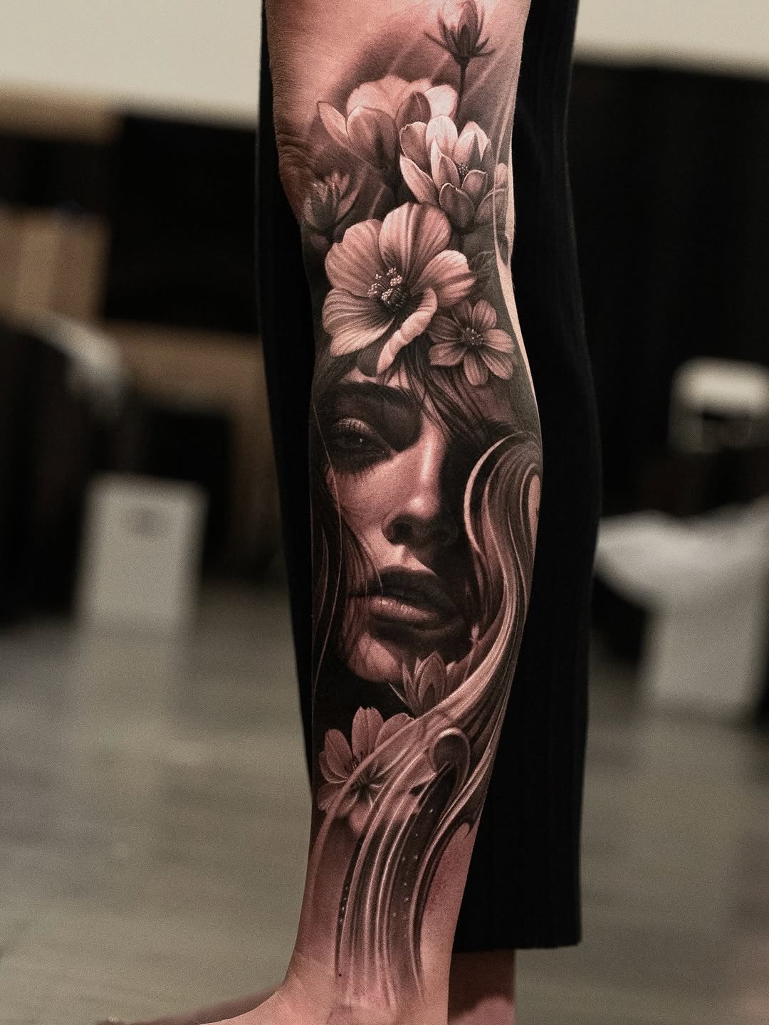 Woman with flowers realism tattoo on the forearm by @_garart_